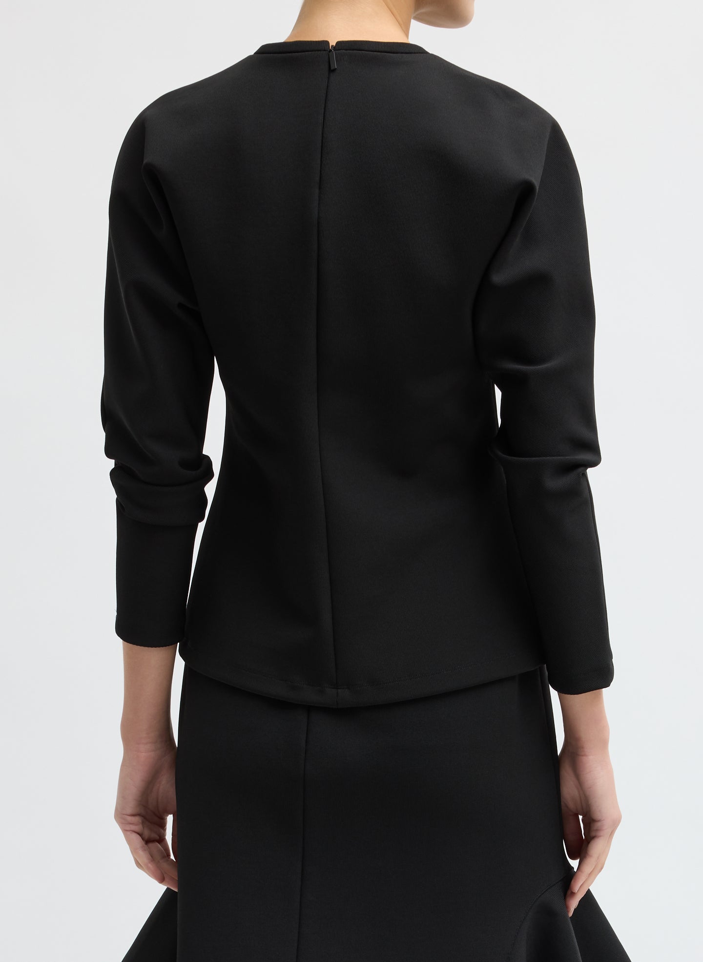 Black Luxe Crepe Knit Dolman Top - long sleeve top, back view on model