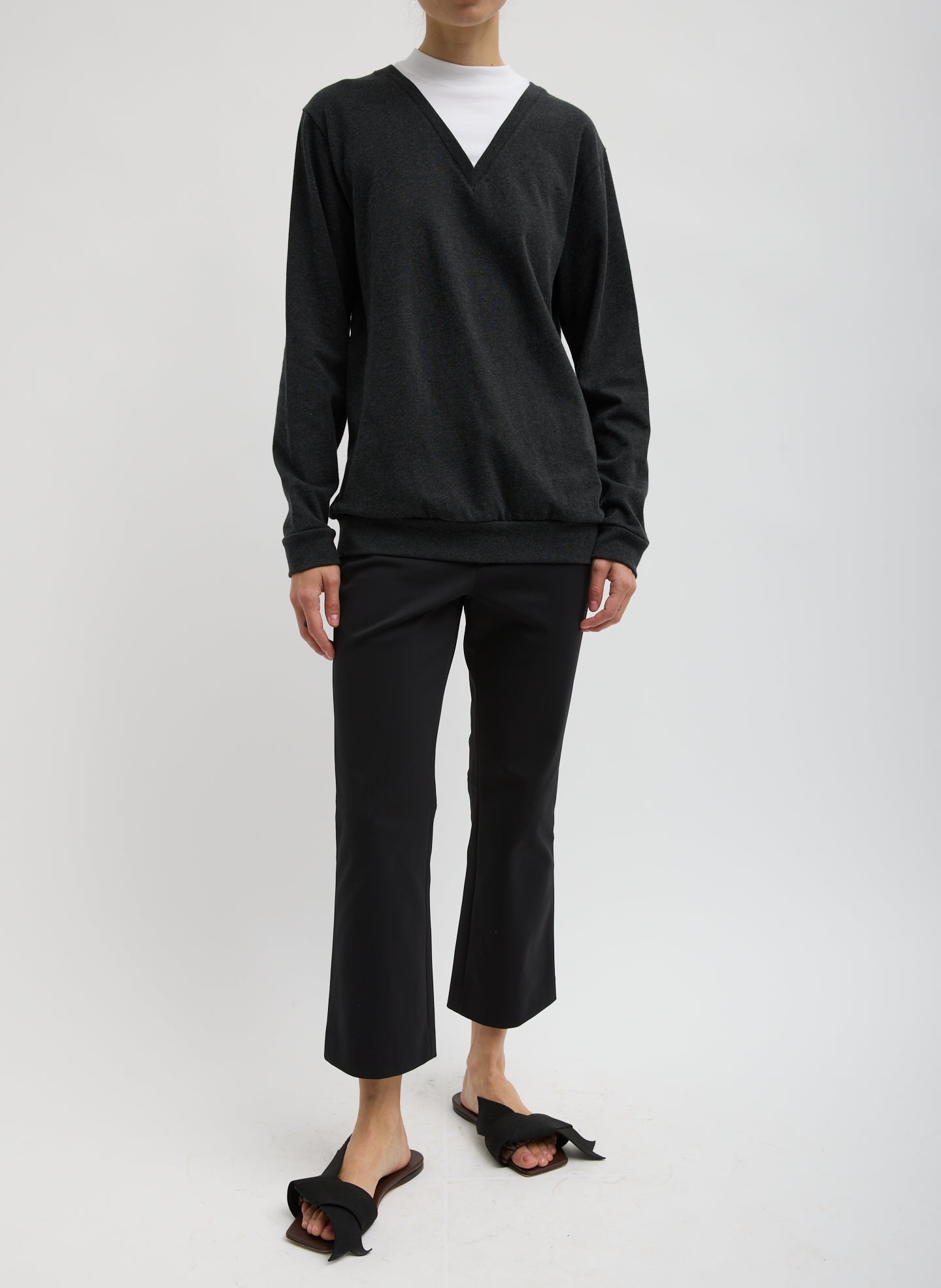 Black Compact Tech Knit Cropped Bootcut Pant - full look, front view on model