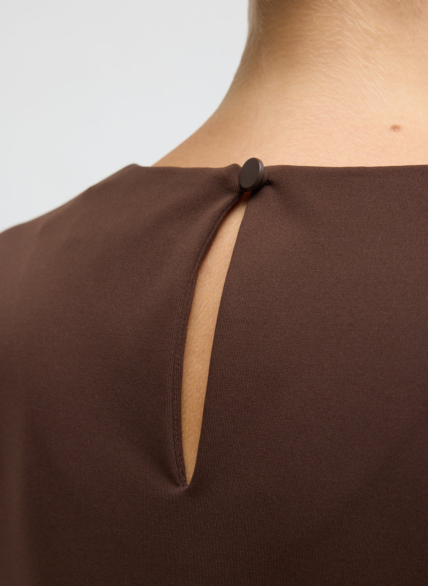 Brown Compact Ultra Stretch Knit Long Sleeve Slim Top - closeup of back button closure