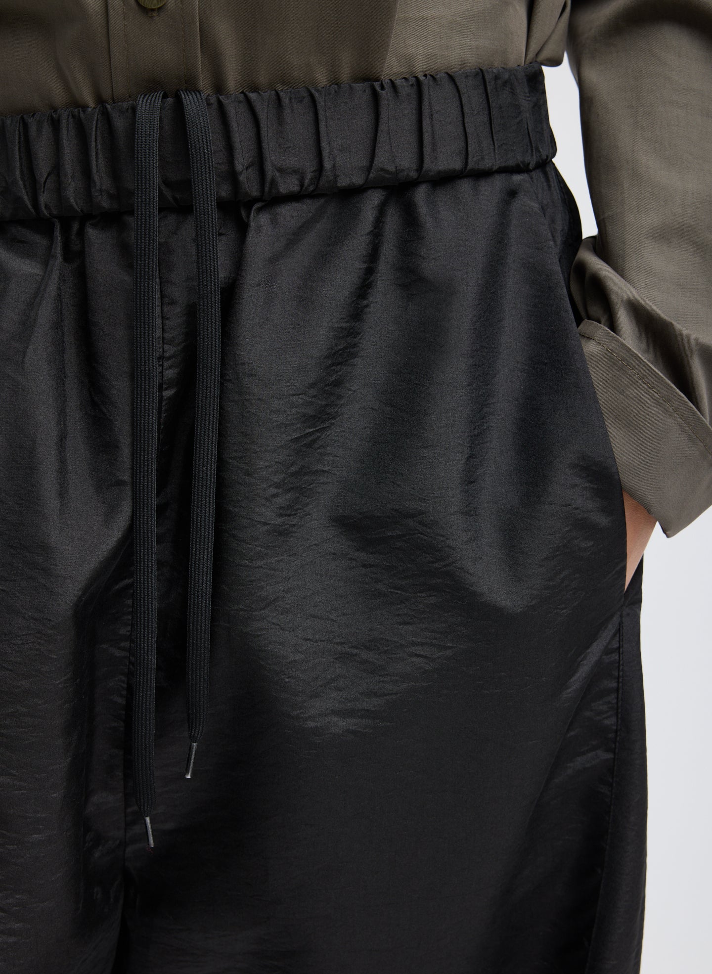 Black Crispy Nylon Winslow Pant - barrel leg pull on pant, closeup shot