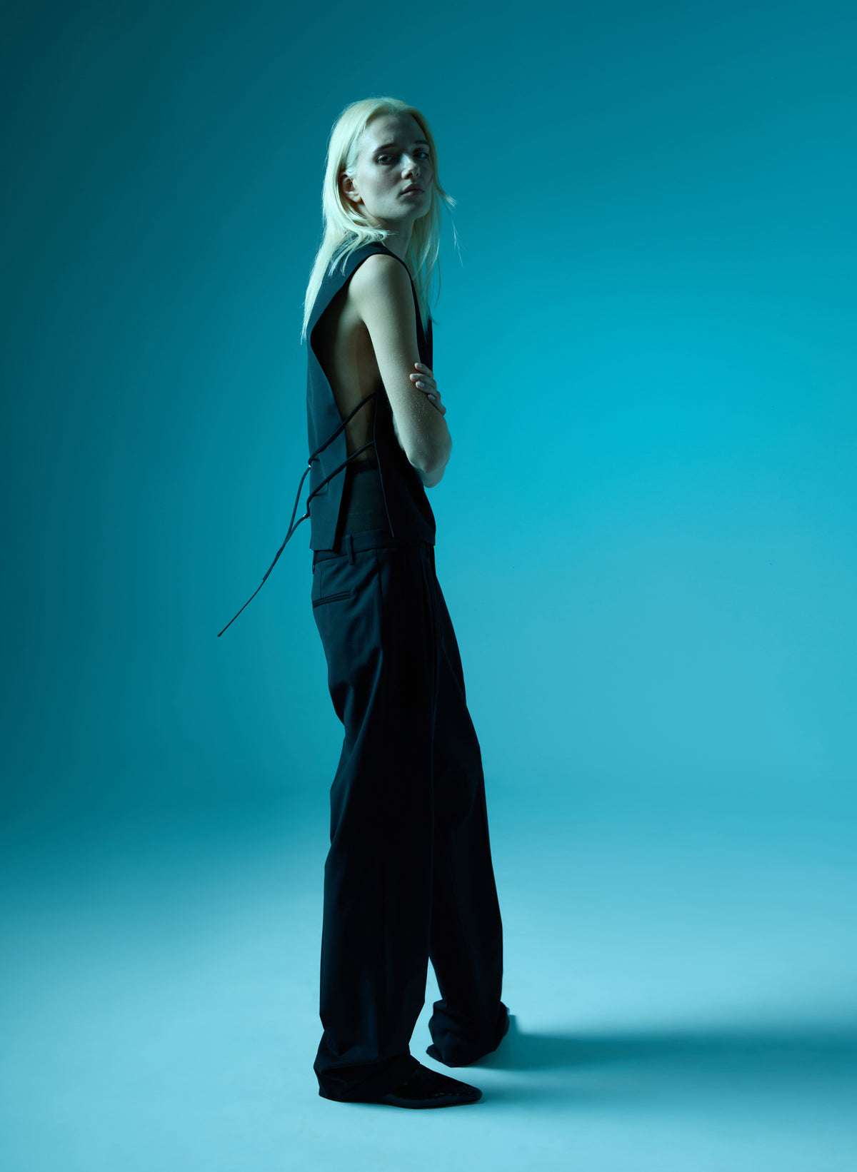 Black Recycled Tropical Wool Bib Top - sleeveless top, editorial image on model