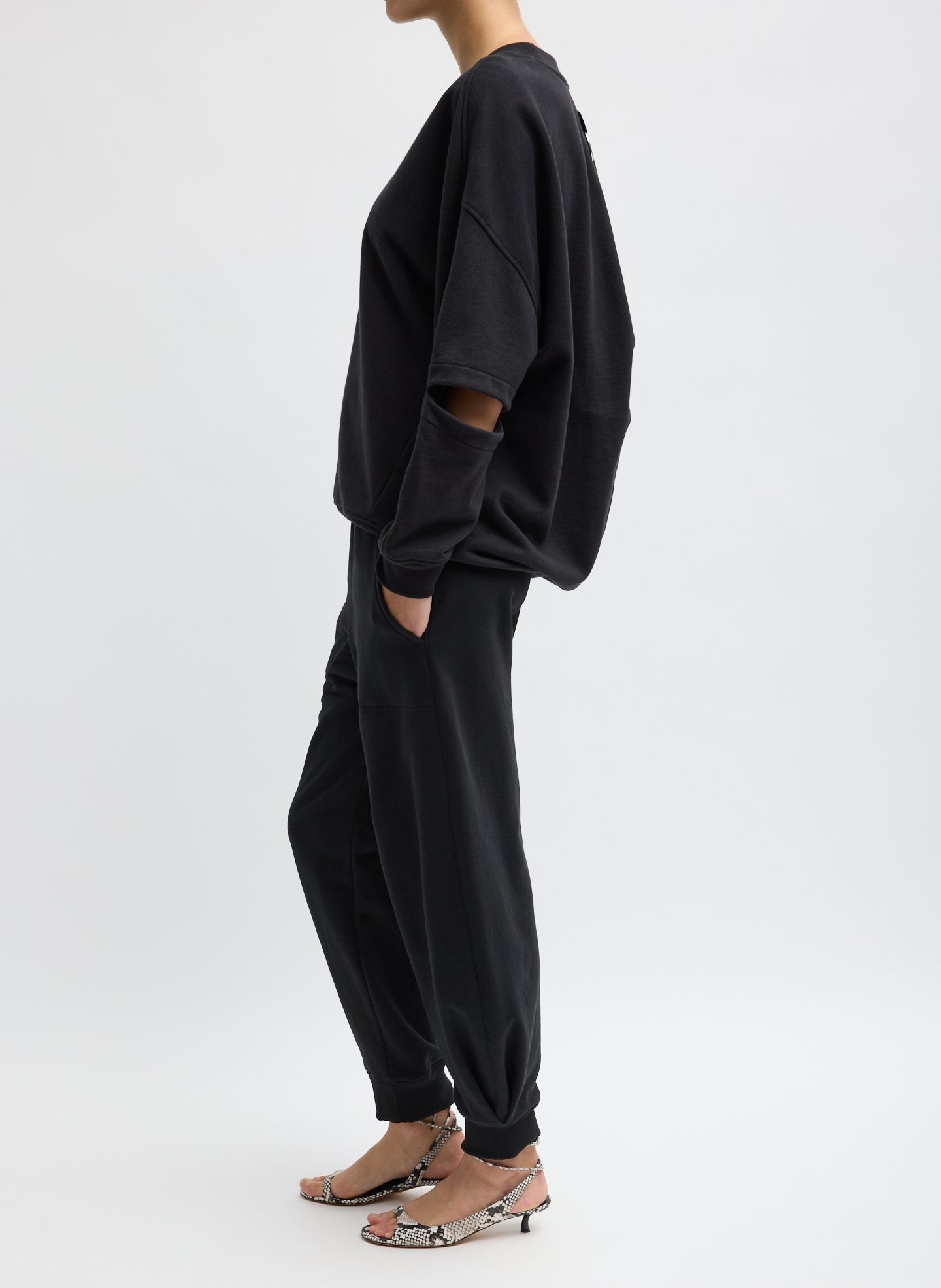 Black Calder Sweatpant - barrel leg sweatpant, side view on model
