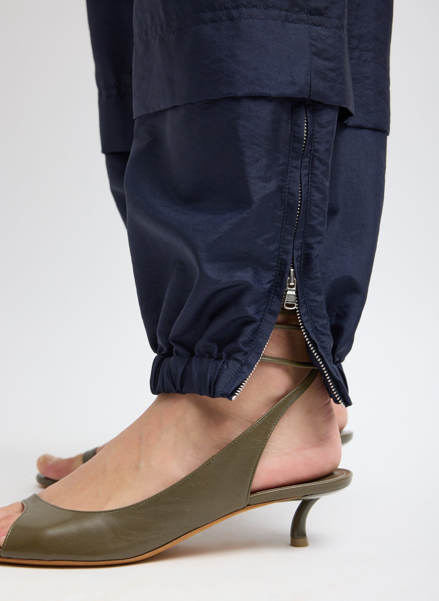 Navy Crispy Nylon Wilt Pull On Jogger - closeup of zip detail at hem