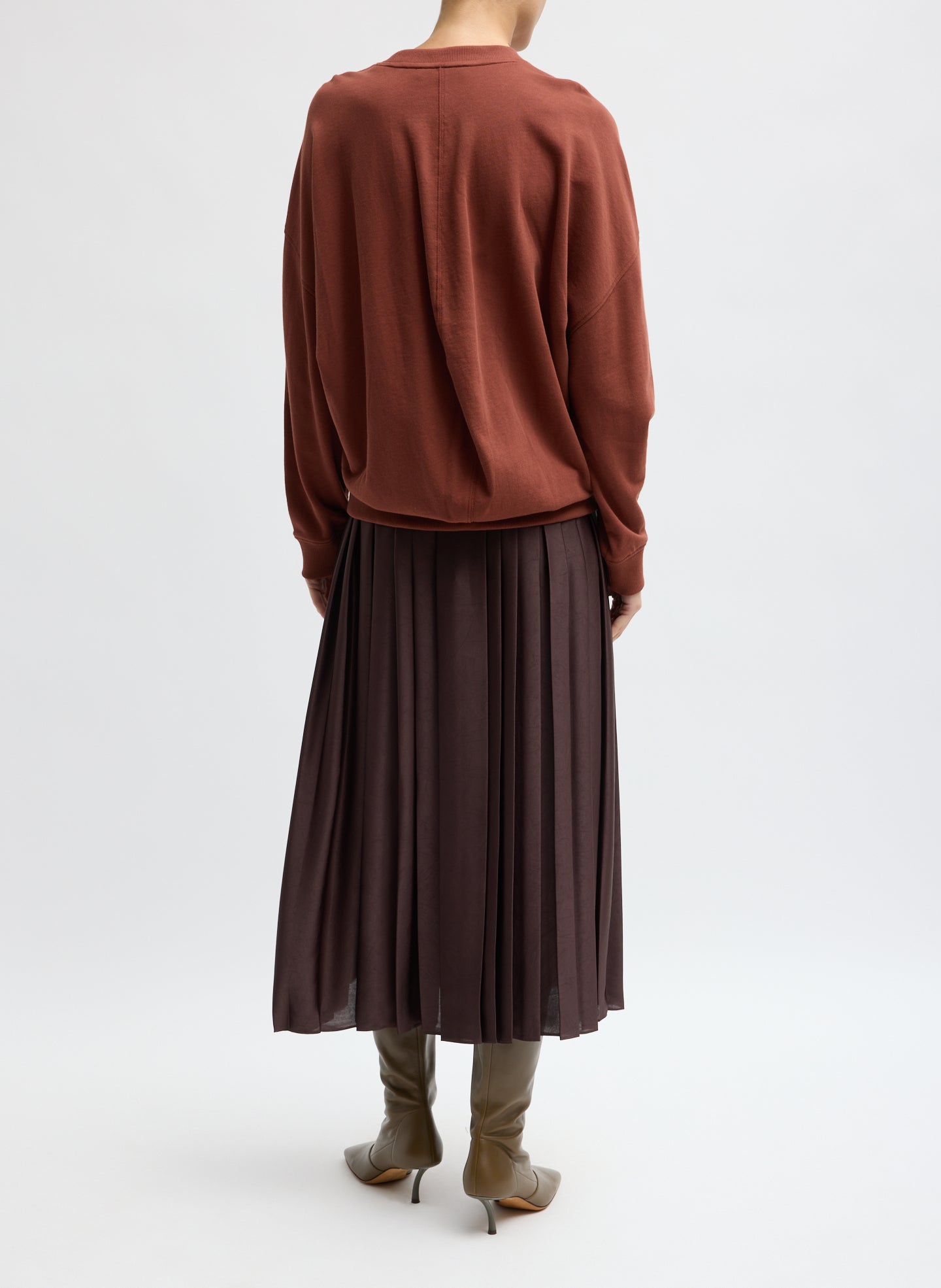 Brown Feather Weight Pleated Pull On Skirt - back view on model
