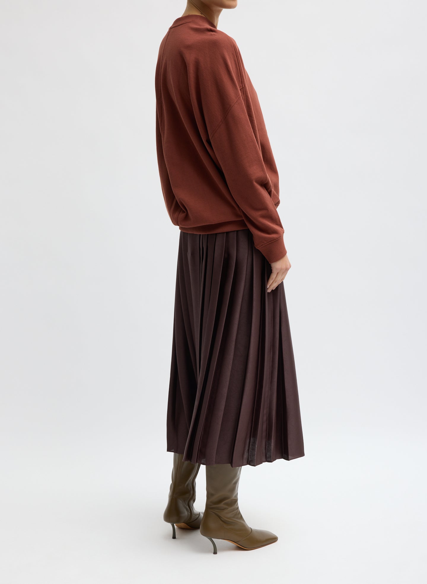Brown Feather Weight Pleated Pull On Skirt - side view on model