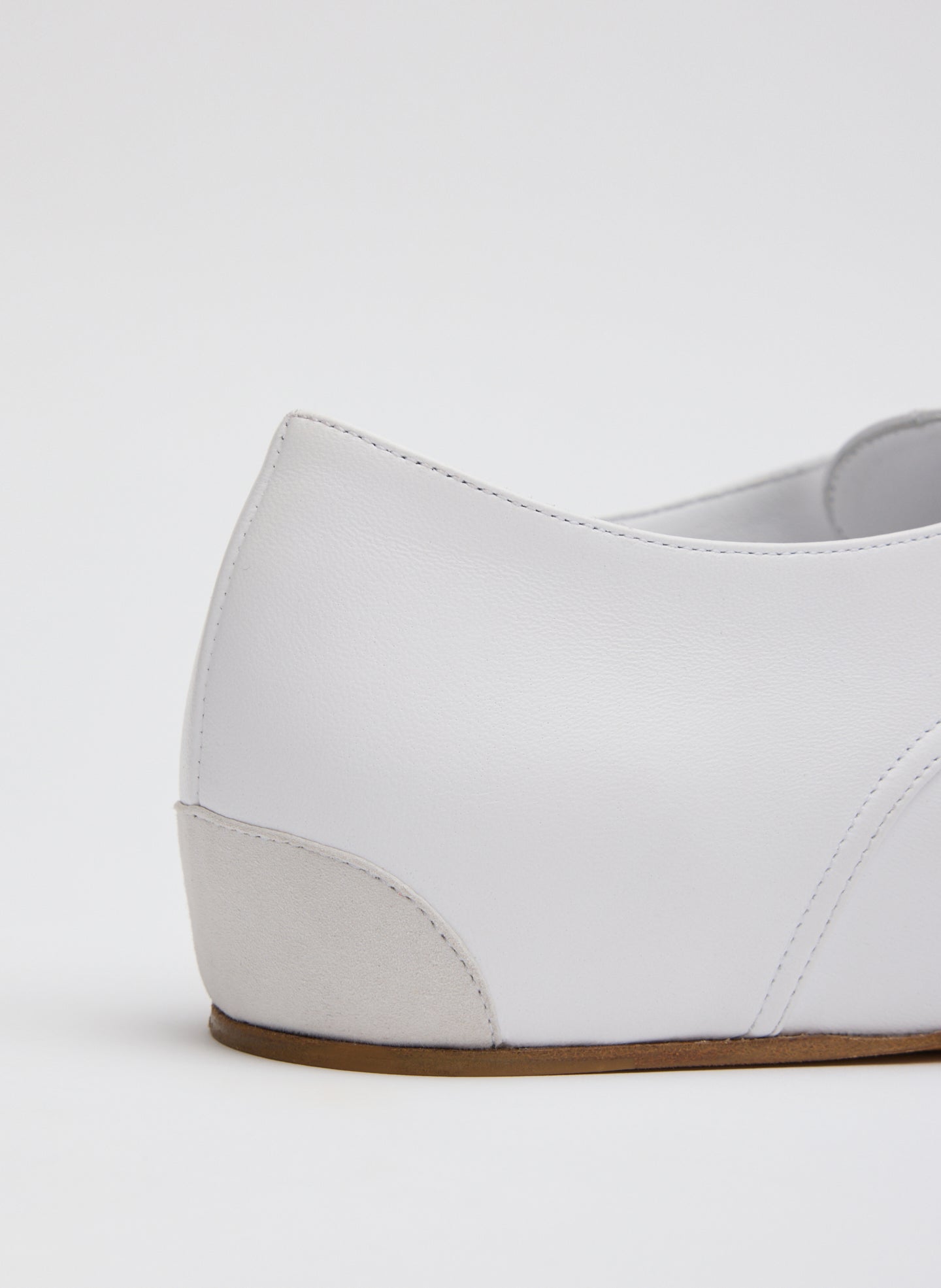 White Leather Oxford Flats - closeup of leather patch at heel