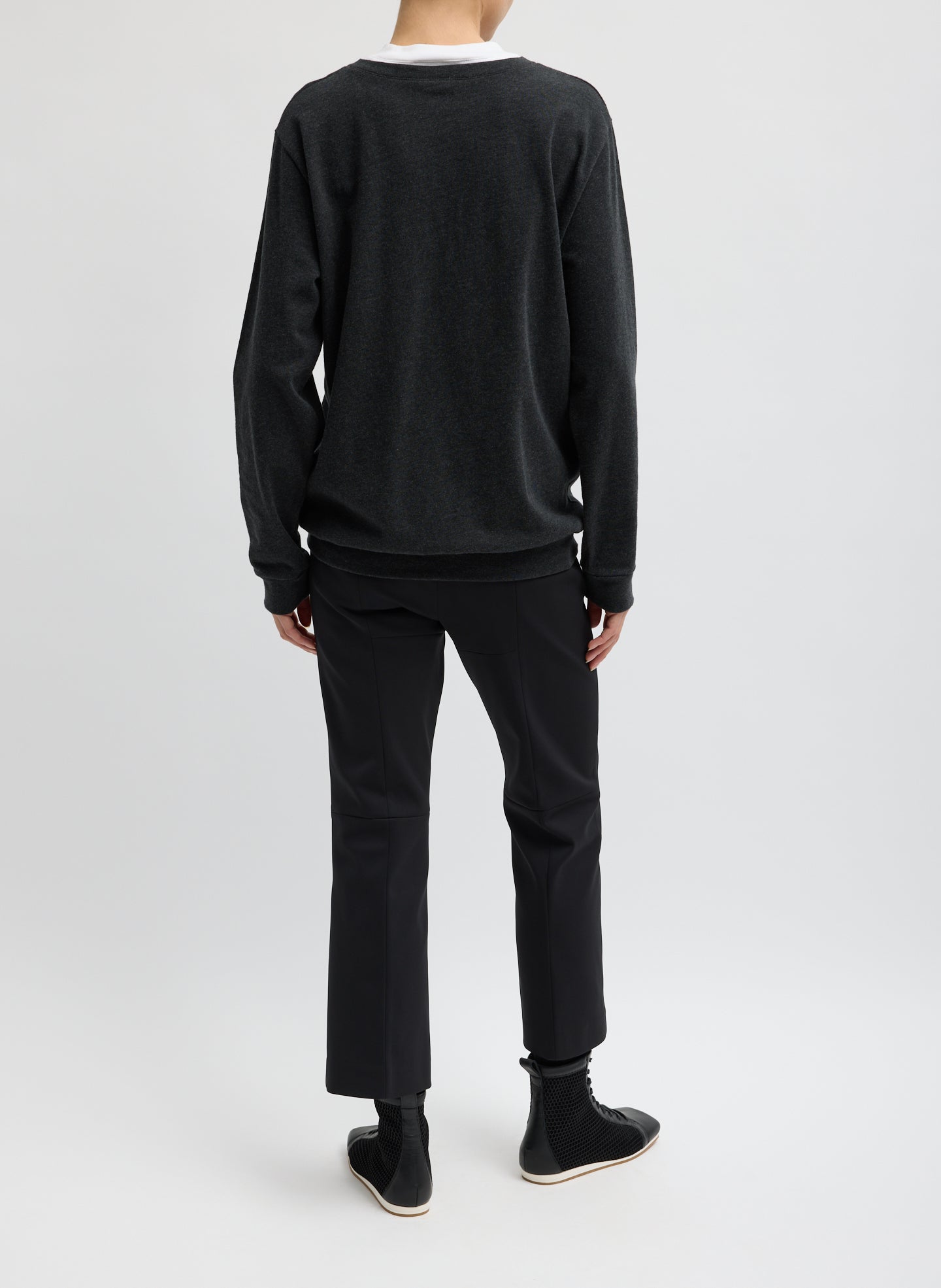 Black Compact Tech Knit Cropped Bootcut Pant - full look, back view on model
