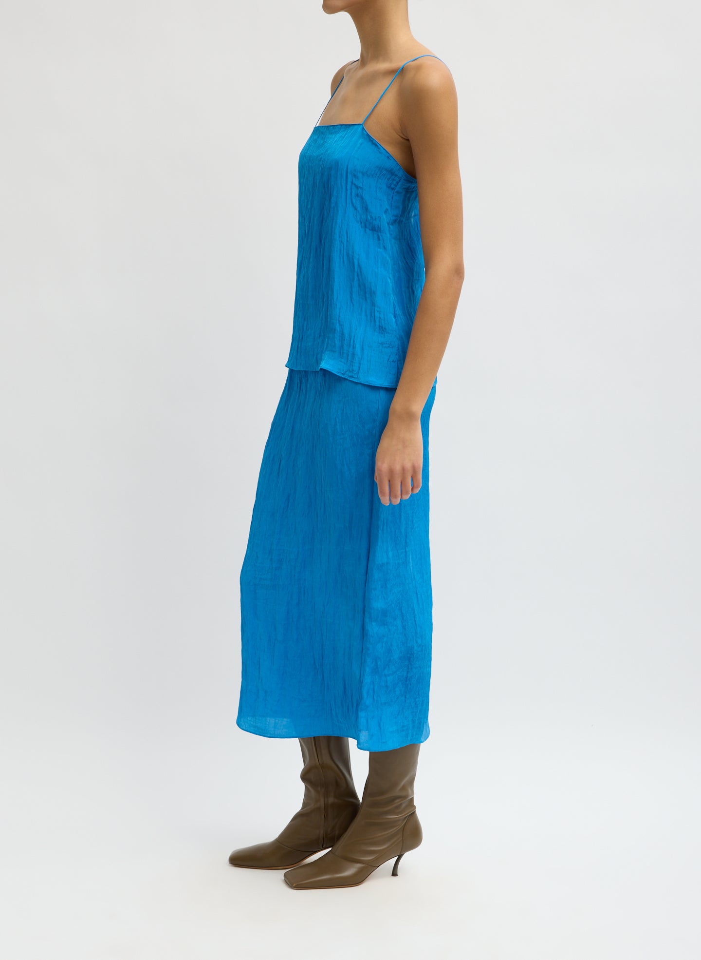 Bright Blue Crinkle Slip Skirt - midi slip skirt, side view on model