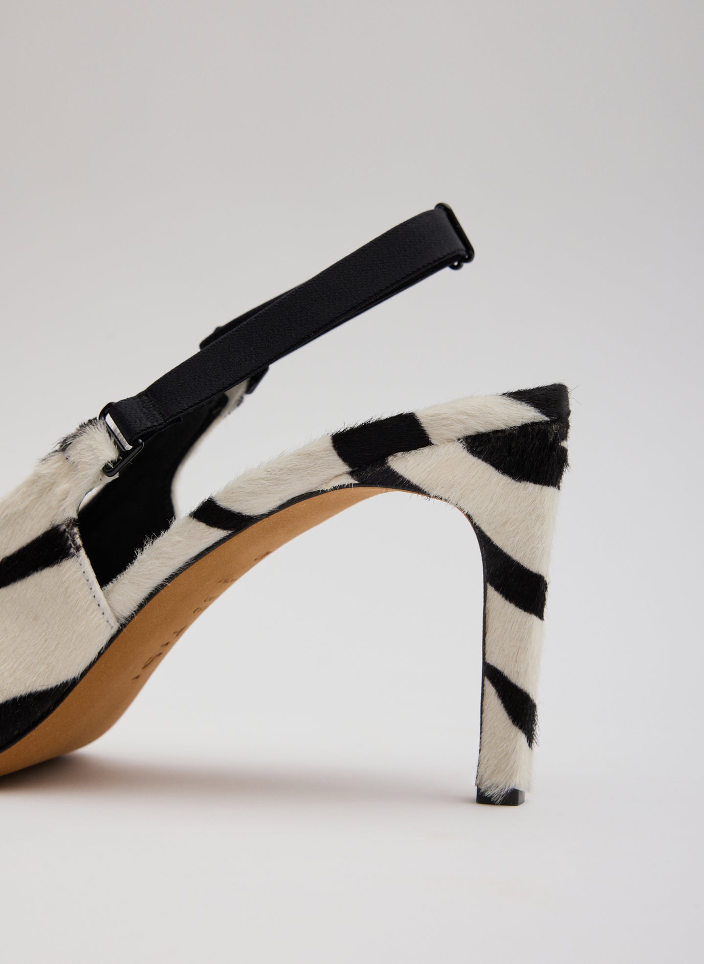 Black and White Zebra Print Calf Hair Beasley Pump - closeup of heel and back strap detail