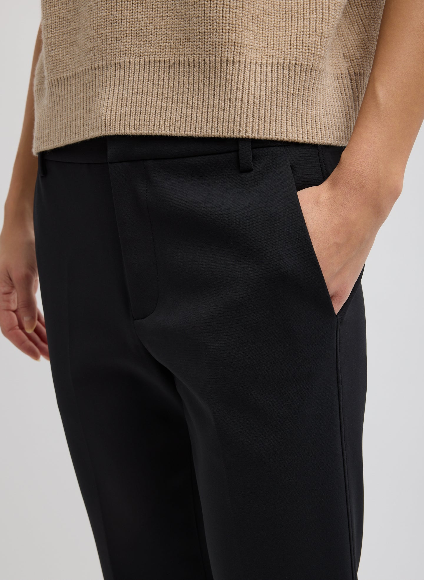 Black Compact Tech Knit Cropped Bootcut Pant - closeup of side pocket detail