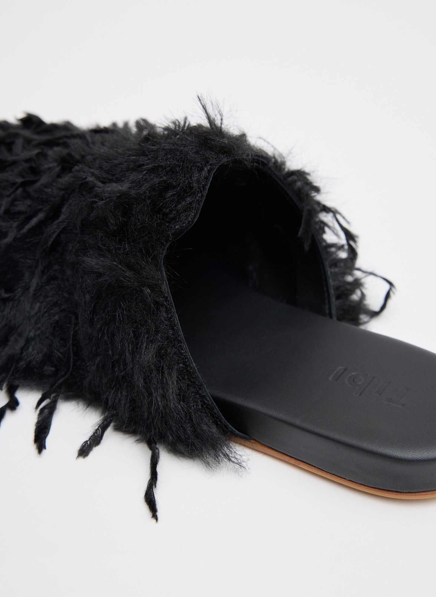 Black Faux Feather Granger Slide - closeup of feathered exterior