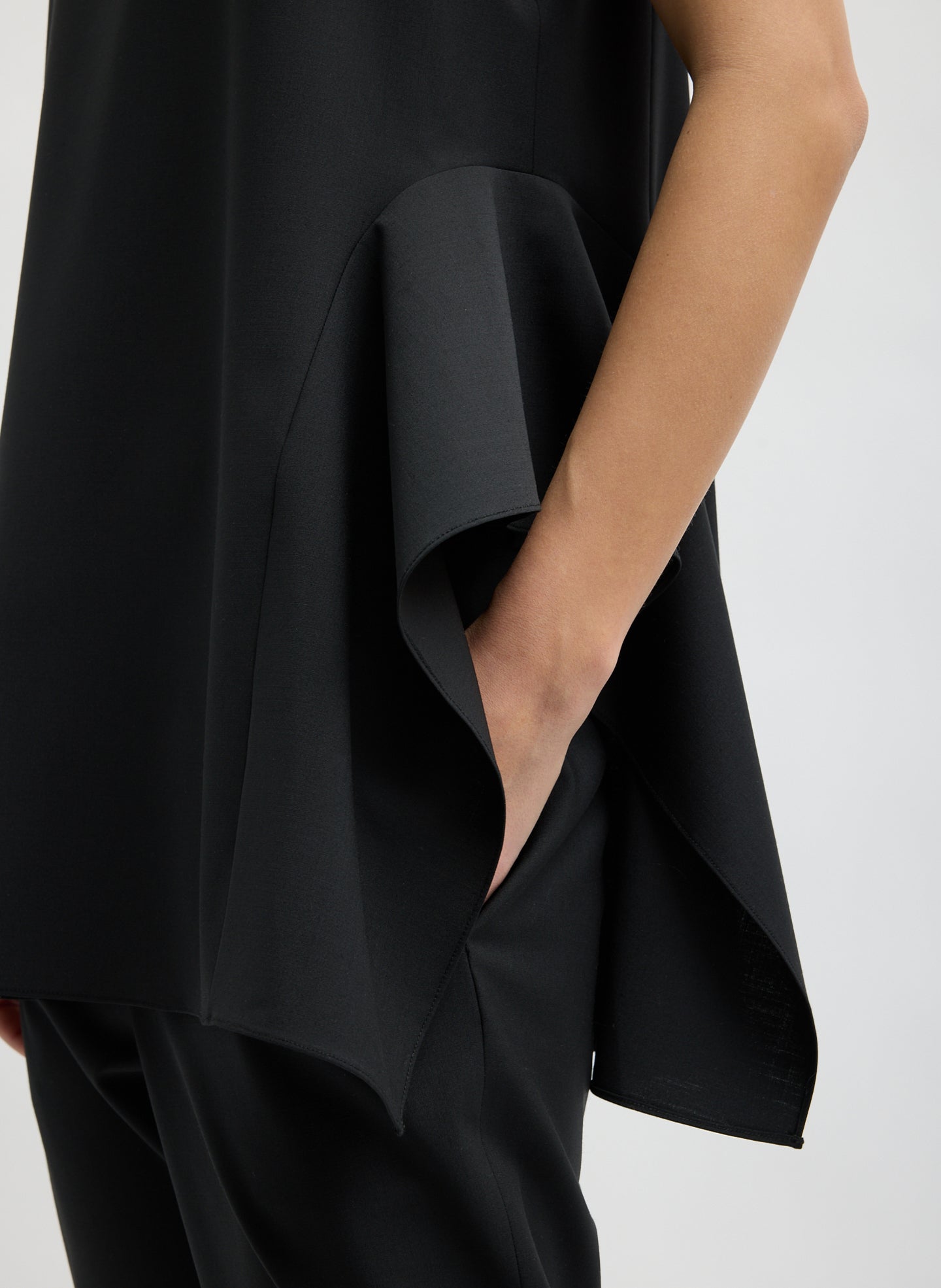 Black Recycled Tropical Wool Side Draped Top - closeup of side drape detail