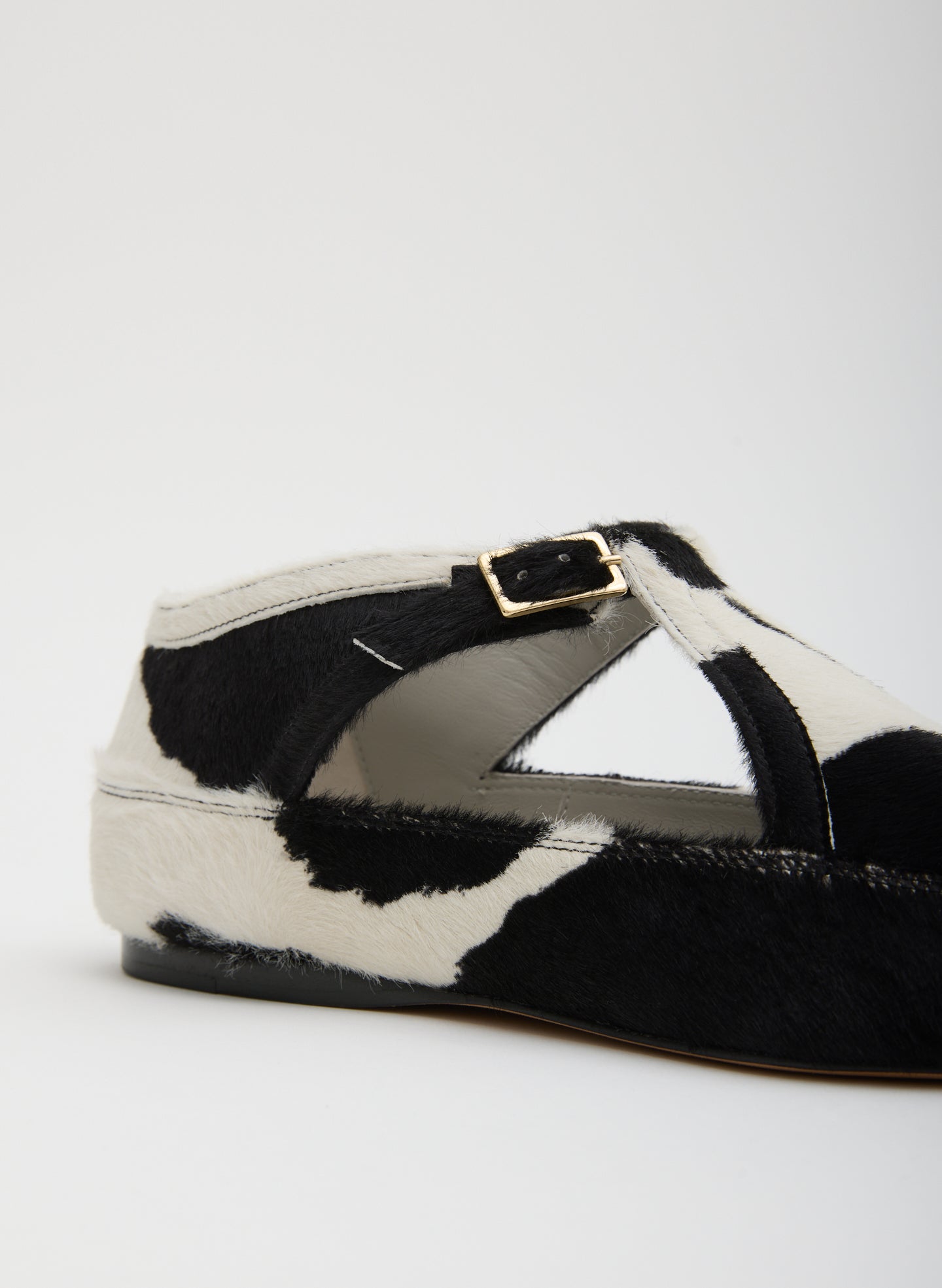 Cow Print Somerset Flat - closeup of buckle detail and calf hair