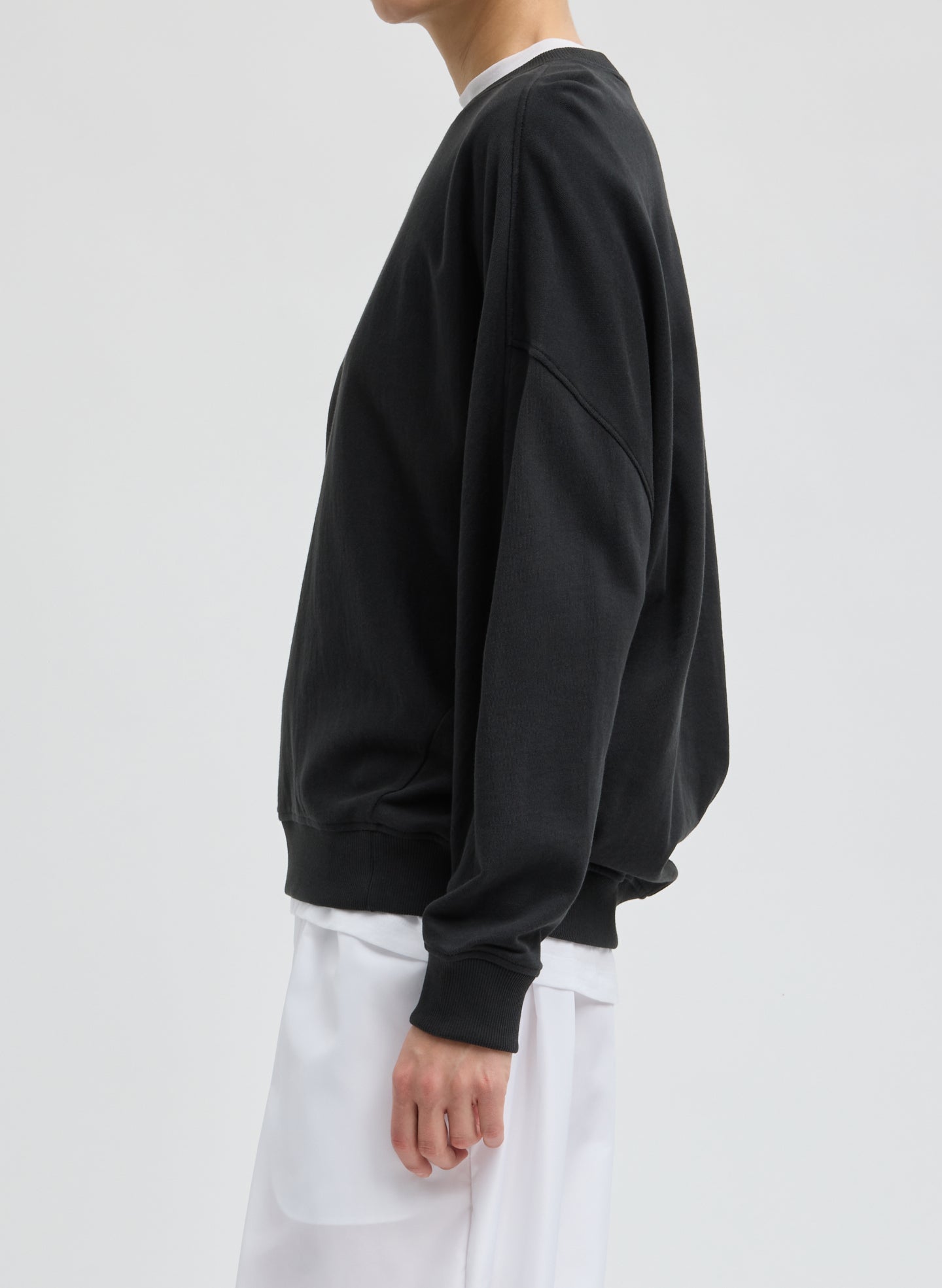 Black Light Weight Sweatshirting Crewneck Sweatshirt - side view on model