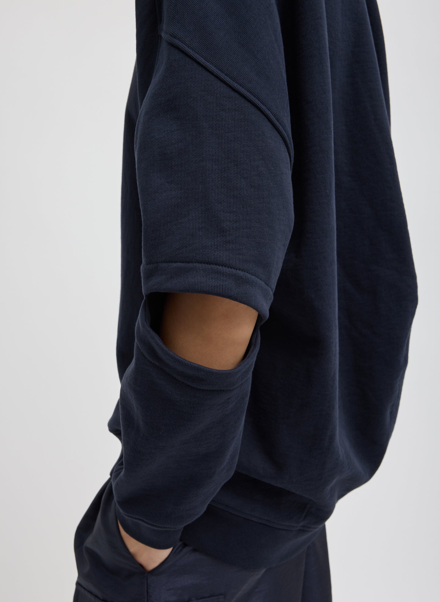 Navy Cocoon Crewneck Sweatshirt - closeup of cutout detail at elbow