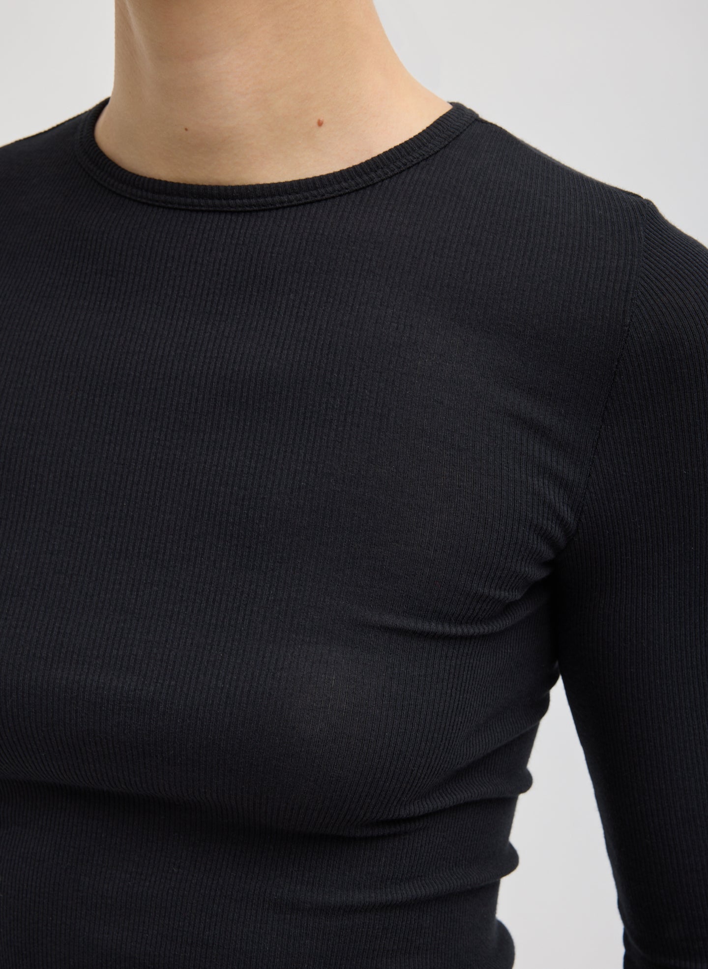 Black Circular Ribbed Crewneck Pullover T-Shirt - closeup of ribbed fabric
