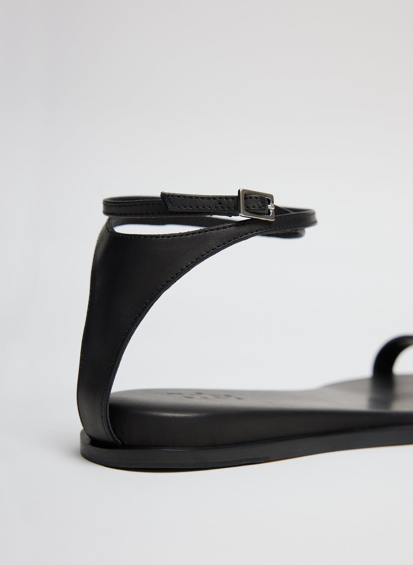 Black Aldwyn Leather Sandal - closeup of back detail