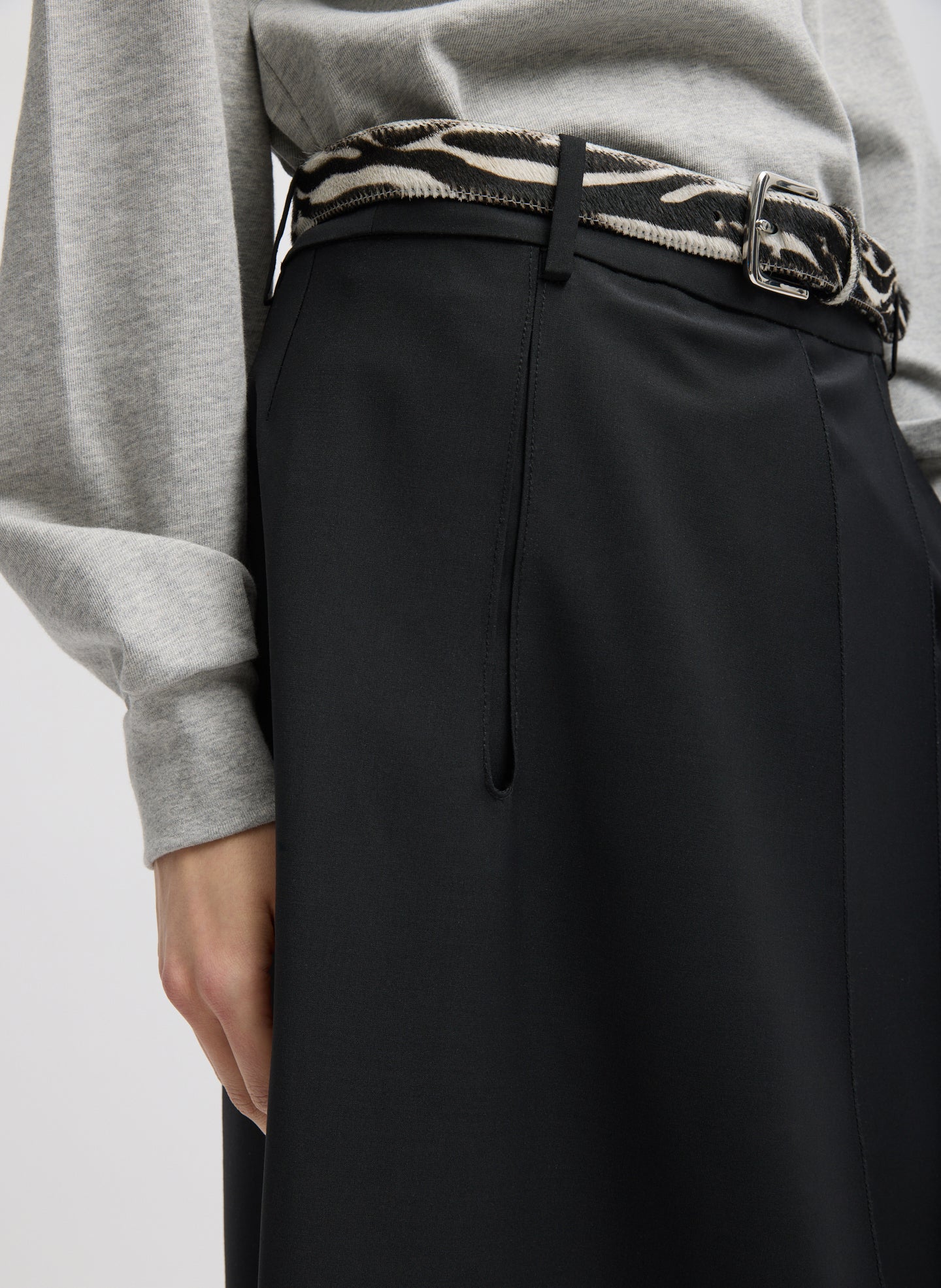 Black Recycled Tropical Wool Pliée Skirt - closeup on side pocket detail