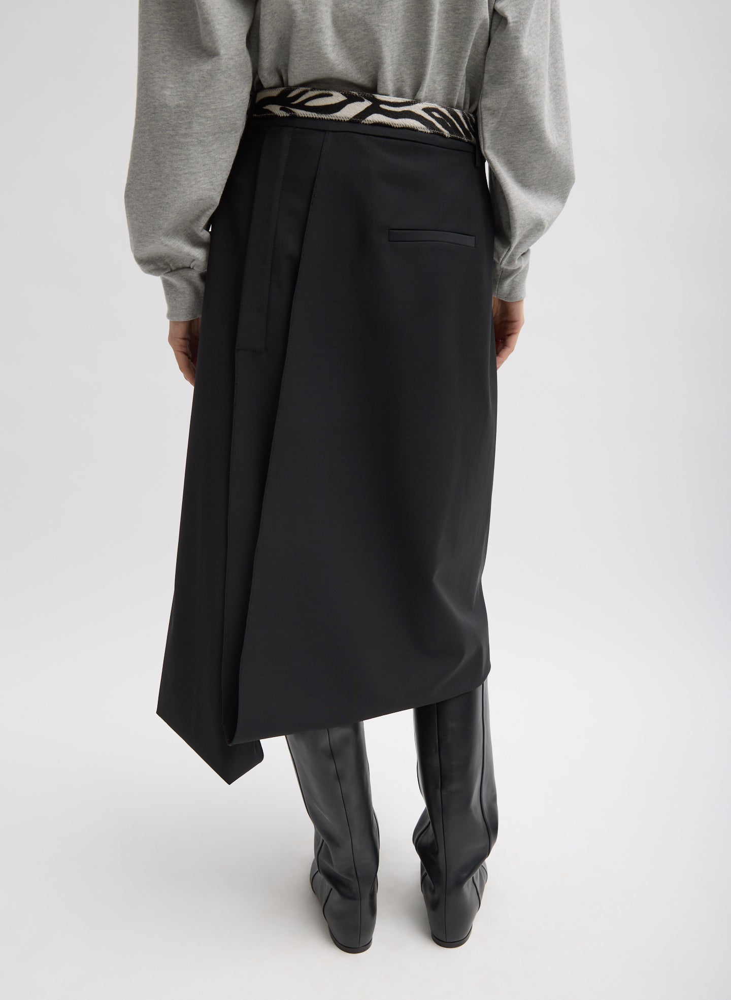 Black Recycled Tropical Wool Pliée Skirt - pleated, back view on model