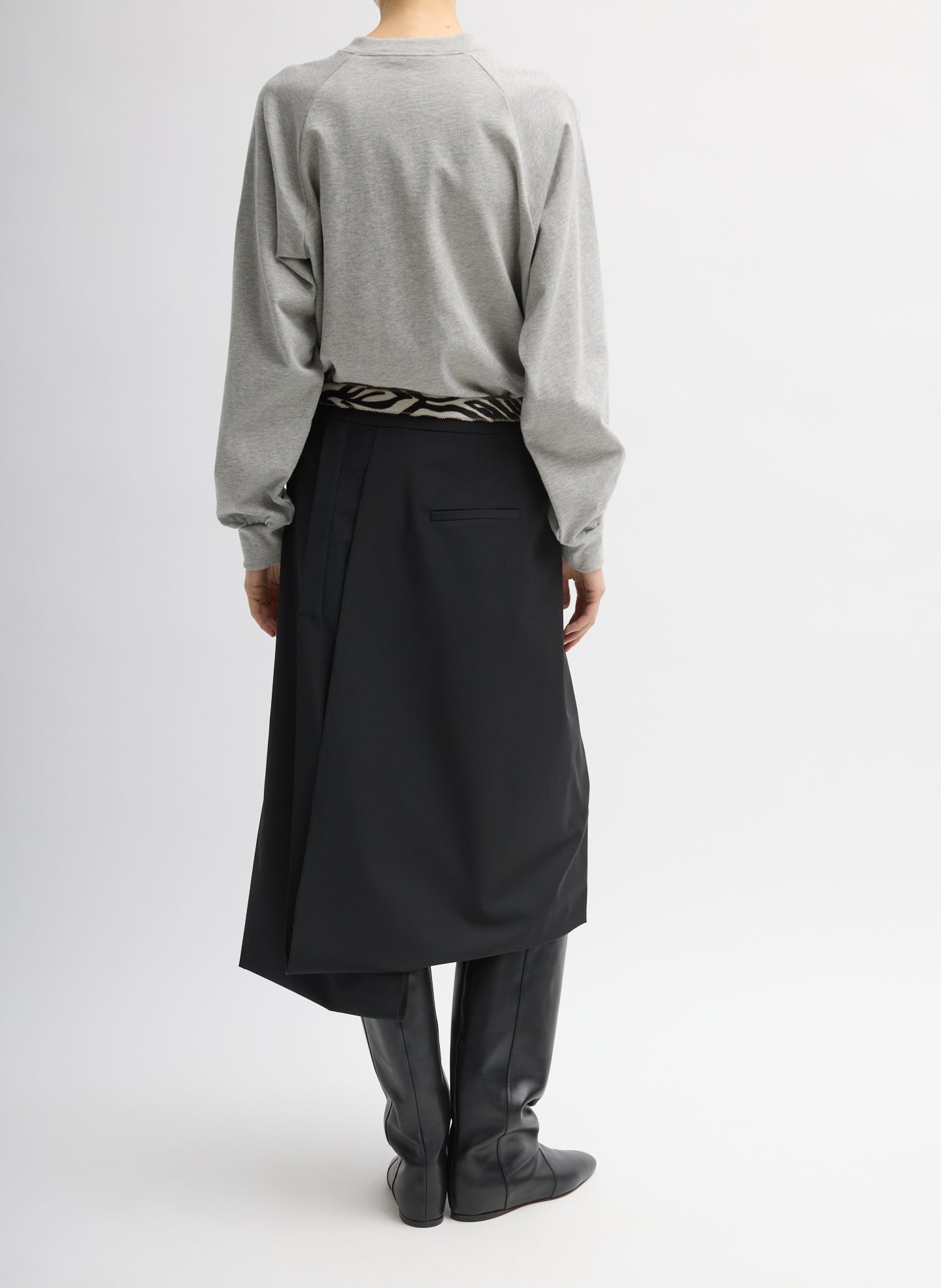 Black Recycled Tropical Wool Pliée Skirt - full look, back view on model