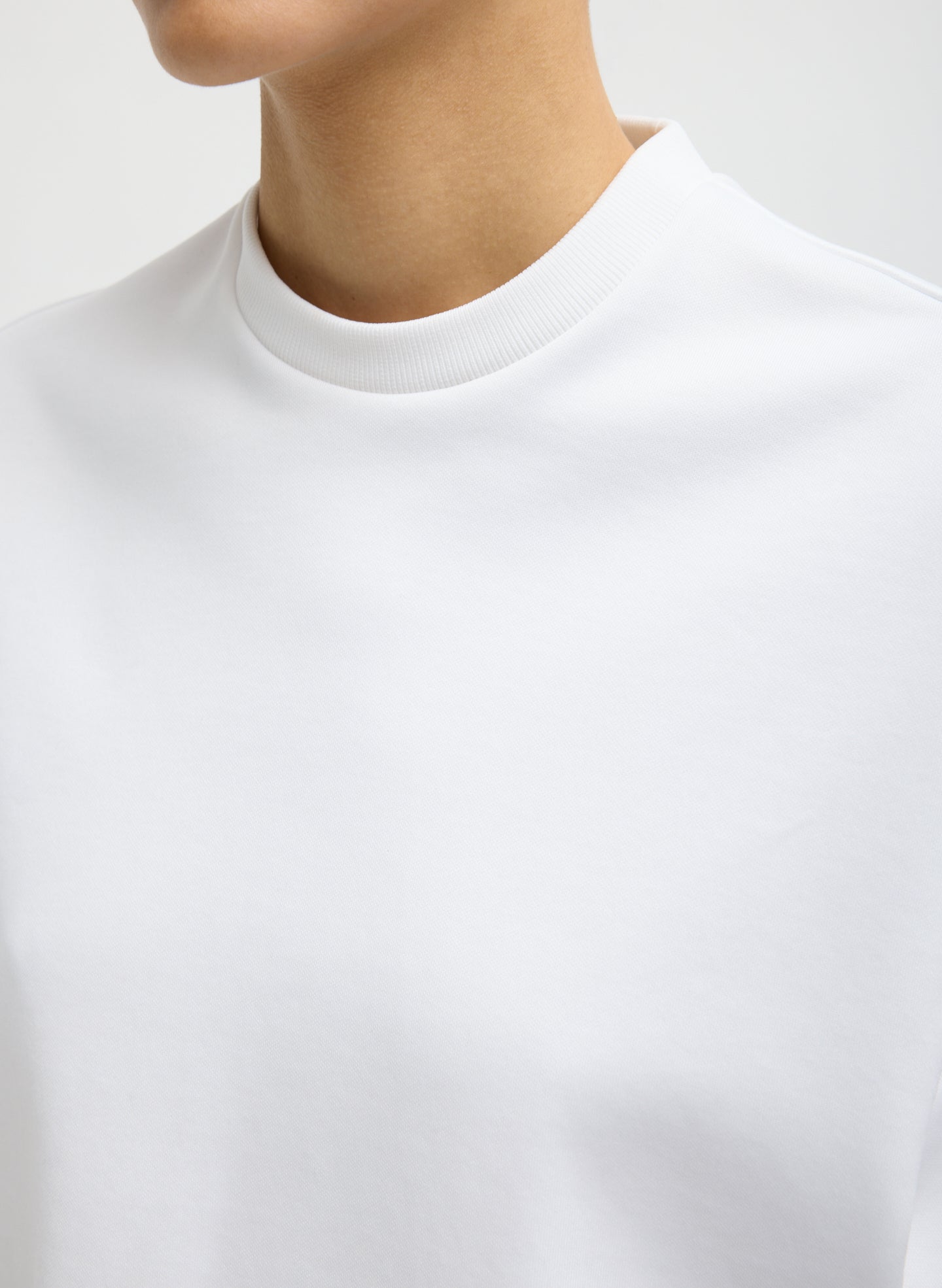 White Active Knit Easy Drape Sleeve T-Shirt - closeup of neckline