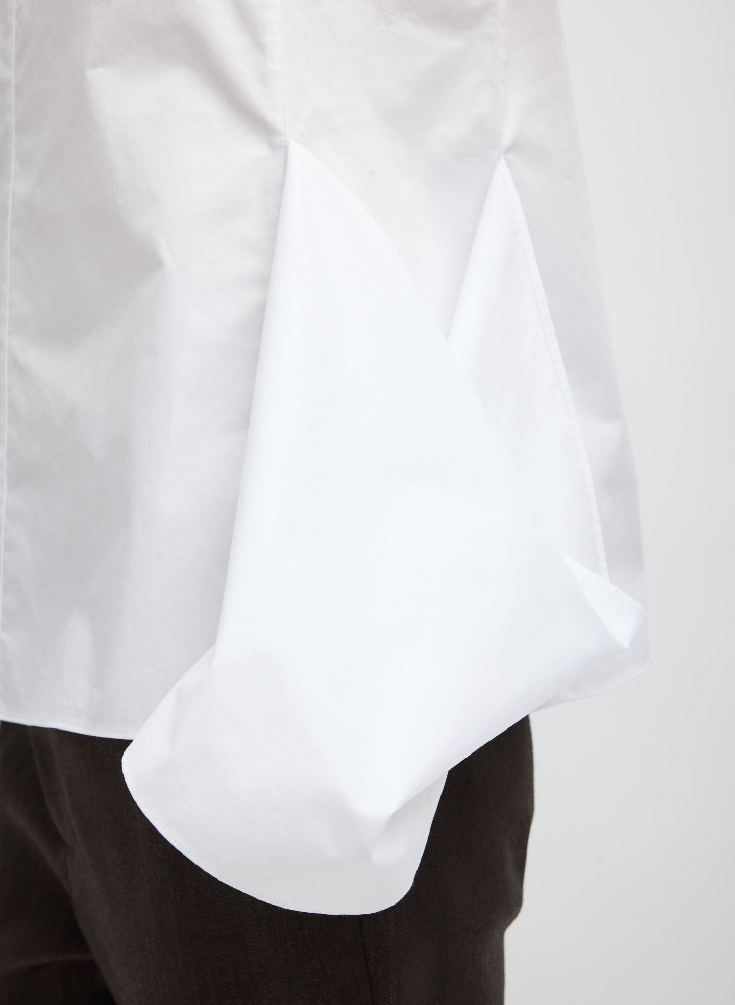 White Eco Poplin Side Drape Top - closeup of drape detail at side
