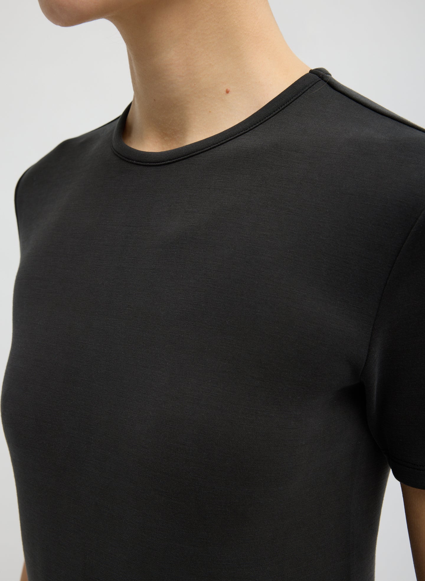 Black Feather Weight Viscose Neoprene Short Sleeve T-Shirt - closeup of neckline
