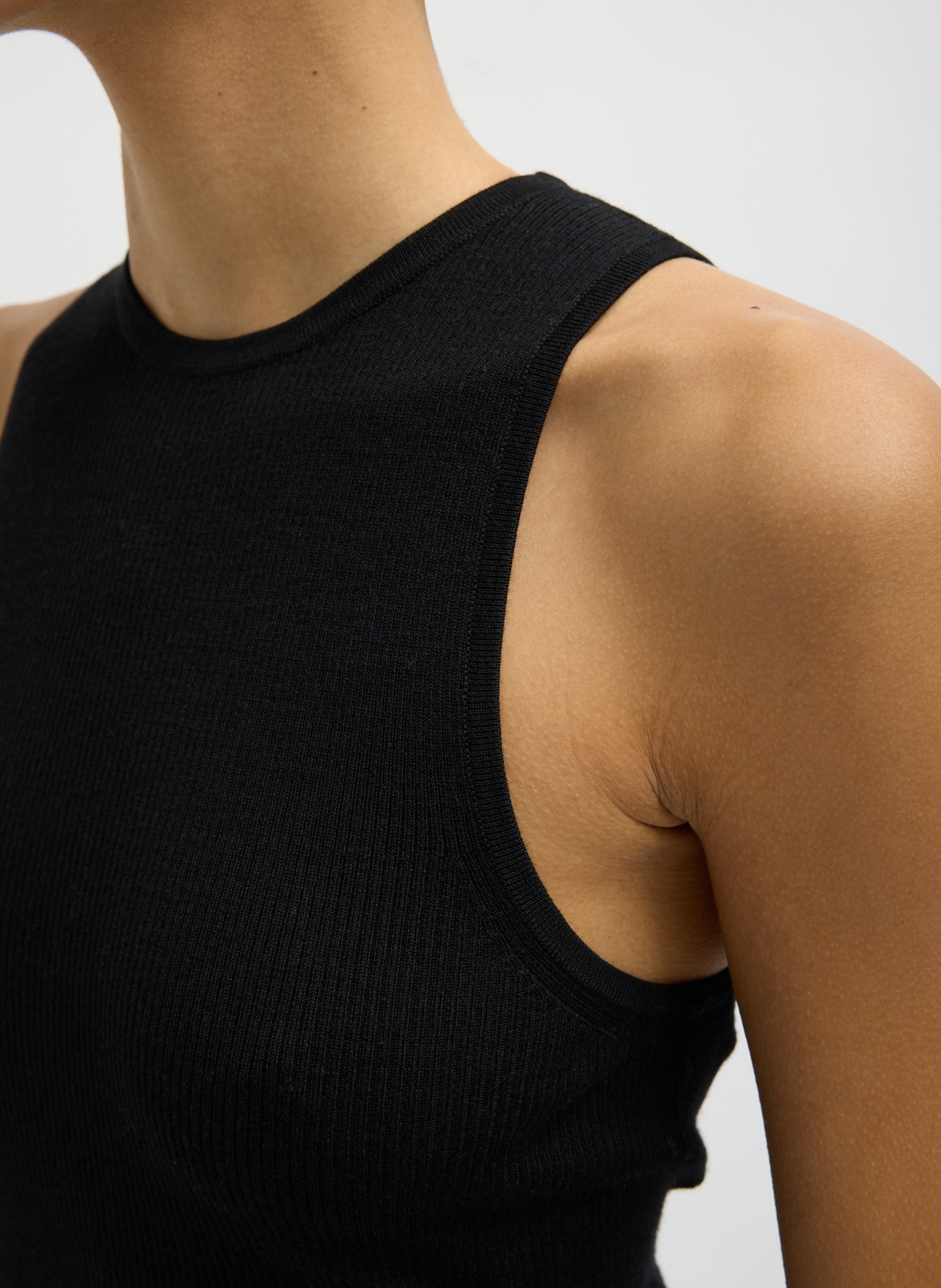 Black Feather Weight Ribbed Cut Out Tank - closeup of ribbed fabric