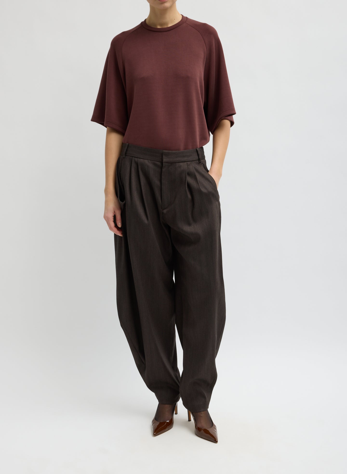 Brown Herringbone Suiting Side Drape Pleated Pant - front view on model