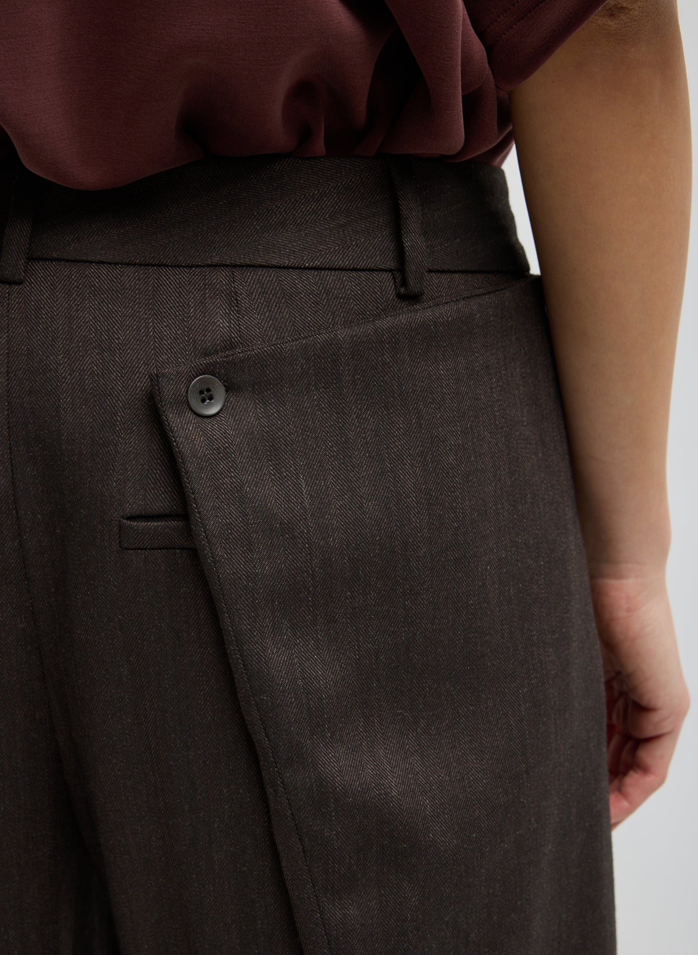 Brown Herringbone Suiting Side Drape Pleated Pant - closeup of back pocket detail