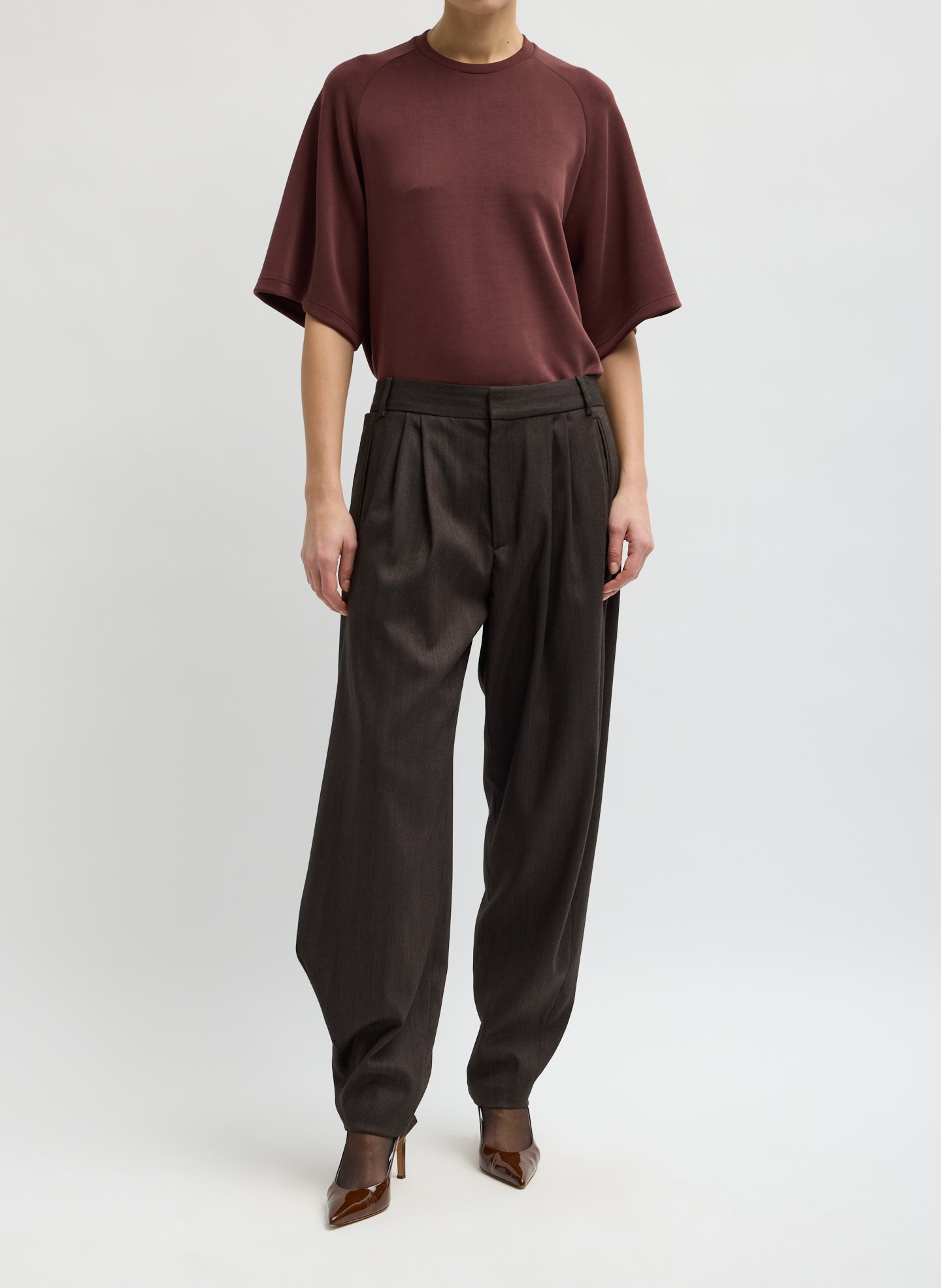 Brown Herringbone Suiting Side Drape Pleated Pant - front view on model