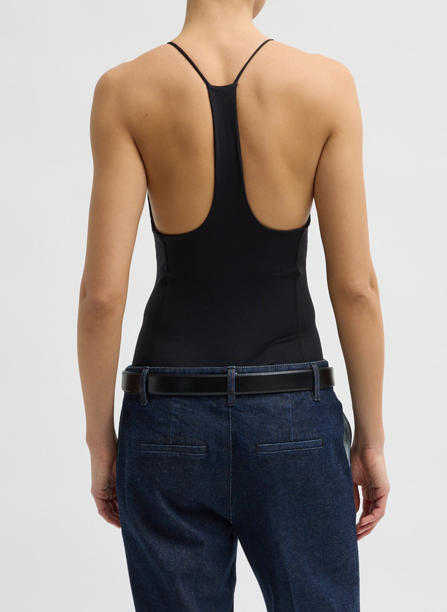 Black Stretch Lightweight Tech Knit Strappy Racerback Tank Top - back view on model
