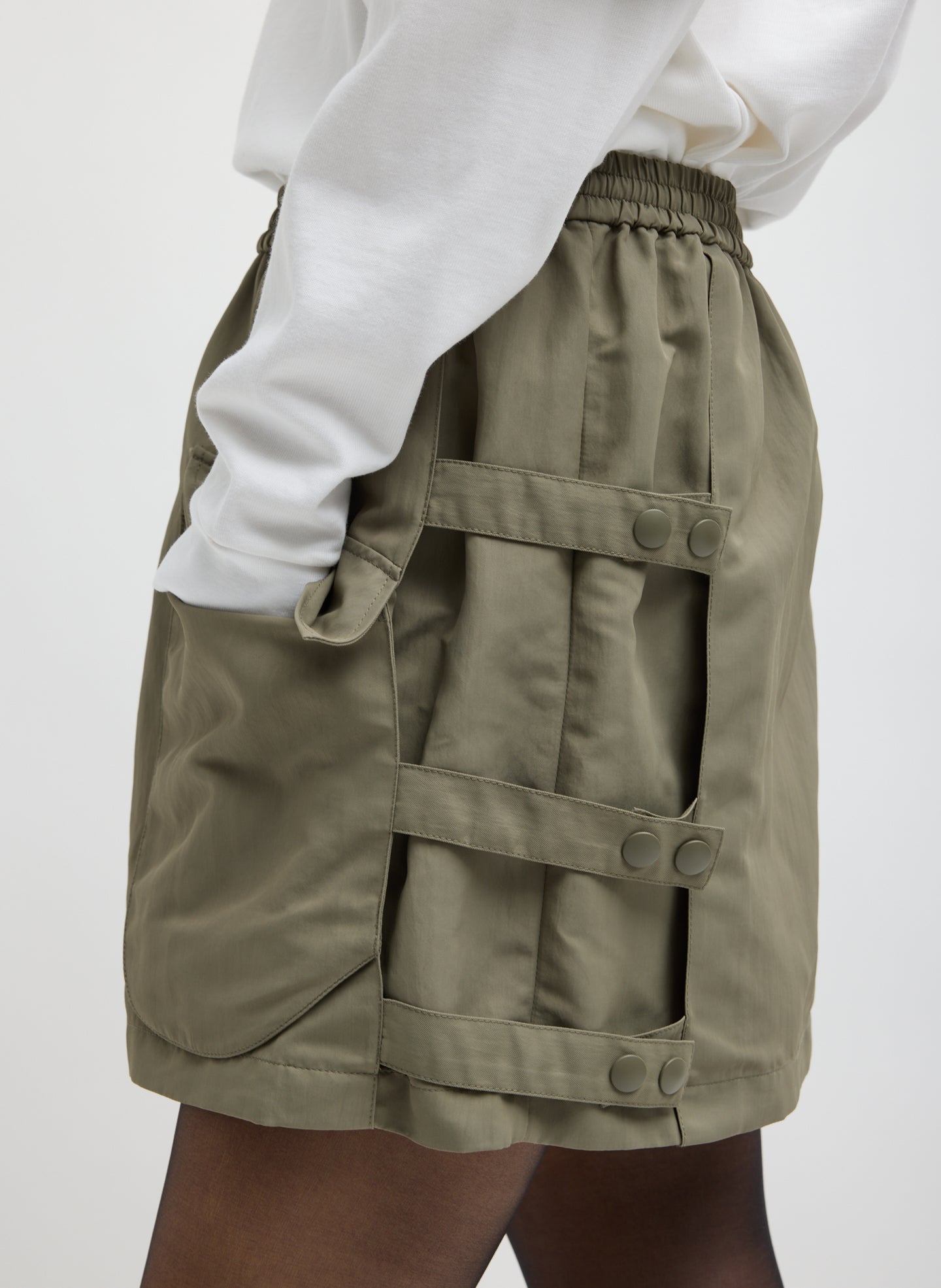 Dark Hazelnut Green Techy Twill Pull On Mini Skirt - closeup of snap details at side