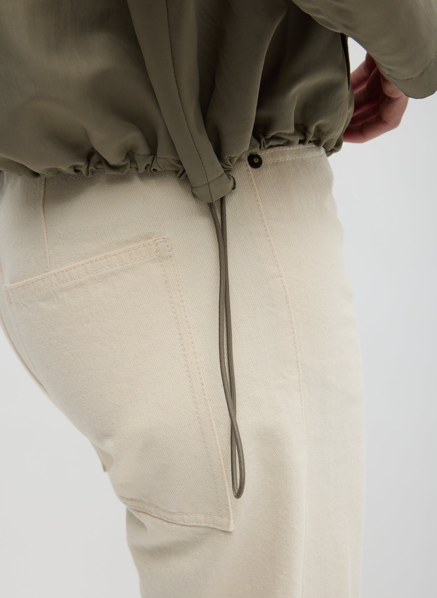 Dark Hazelnut Techy Twill Trapeze Anorak Bomber - closeup of drawstring hem detail