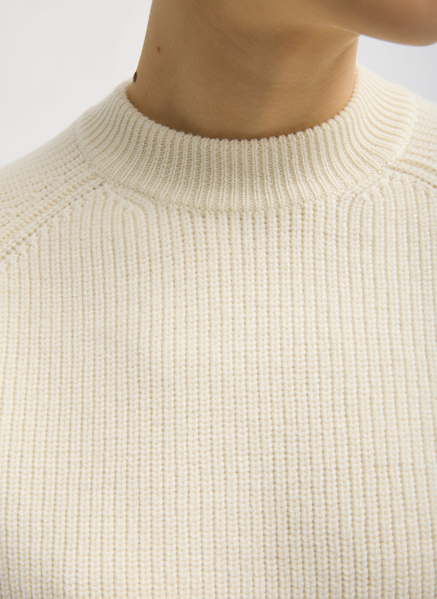 Ivory Cardigan Stitch Wool Shrunken Crewneck Pullover - closeup of ribbed neckline