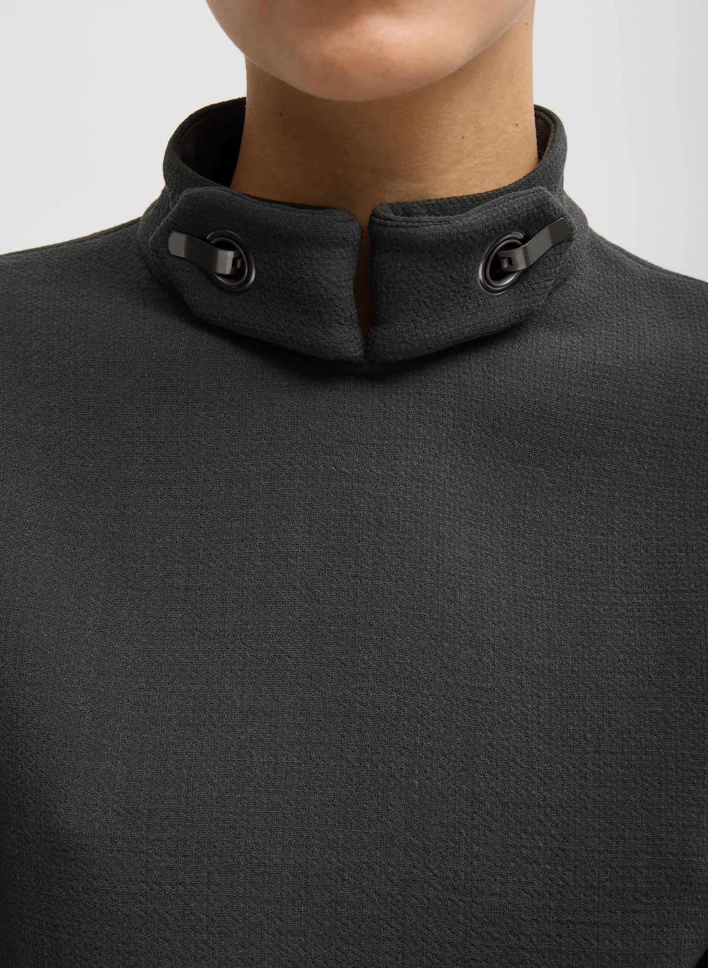 Dark Grey Wool Crepe Fontaine Tunic Top - closeup of metal clasps at  neckline