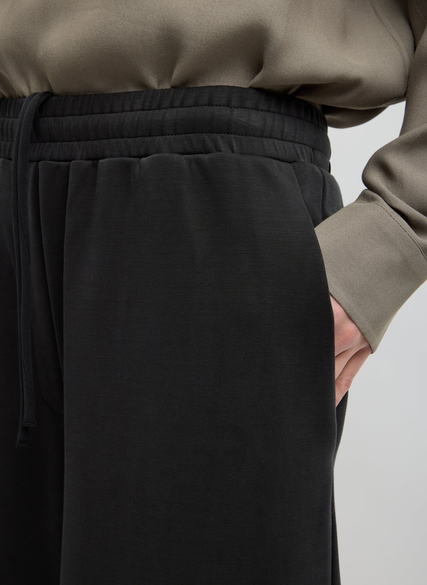 Black Feather Weight Viscose Neoprene Relaxed Short - closeup of side pocket detail