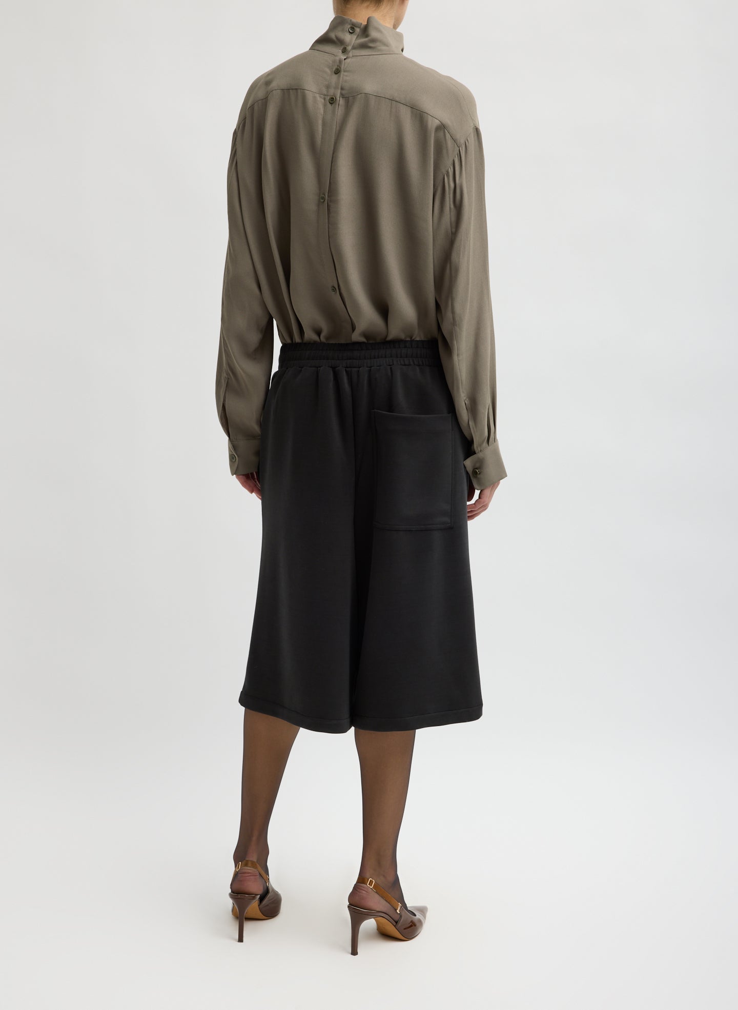 Black Feather Weight Viscose Neoprene Relaxed Short - long sweat short, back view on model