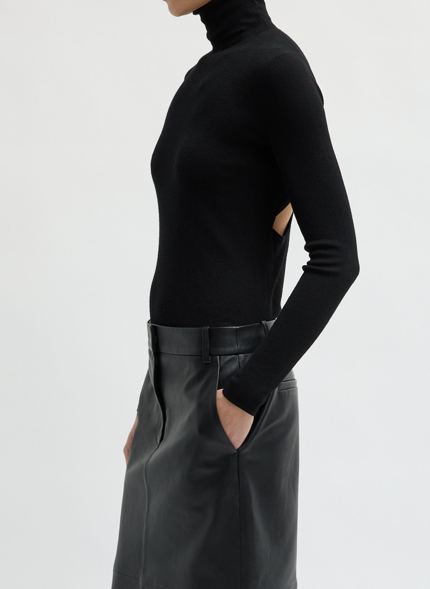 Black Feather Weight Ribbed Turtleneck - side view on model