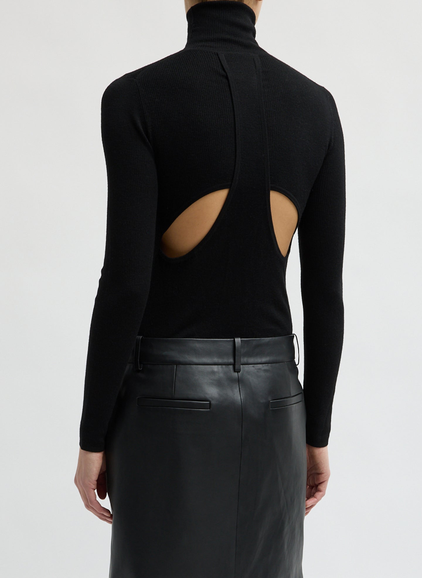 Black Feather Weight Ribbed Turtleneck - back view on model