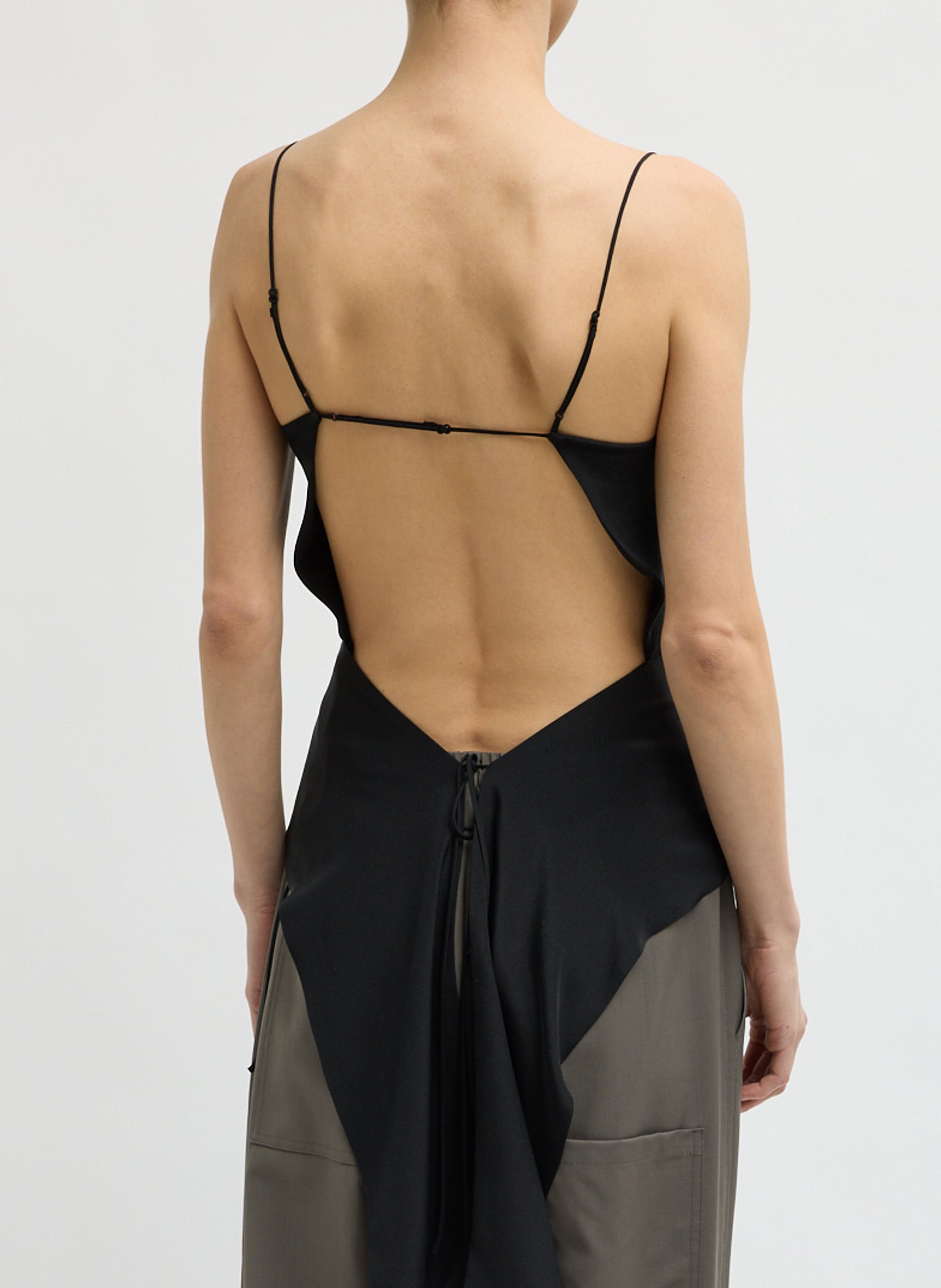 Black 4-Ply Silk Side Drape Cami - sleeveless black top, back view on model