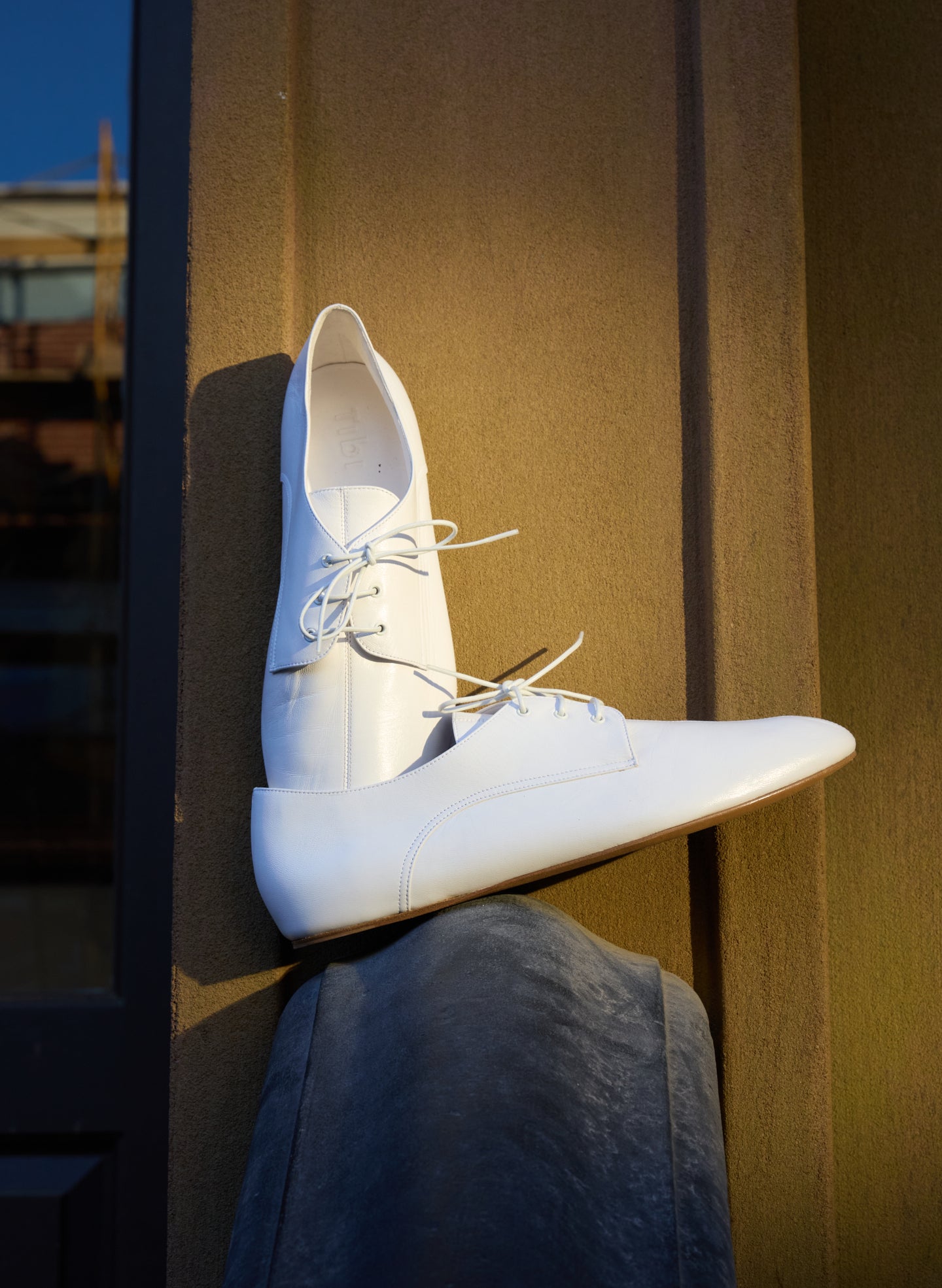 White Leather Oxford Flats - editorial image