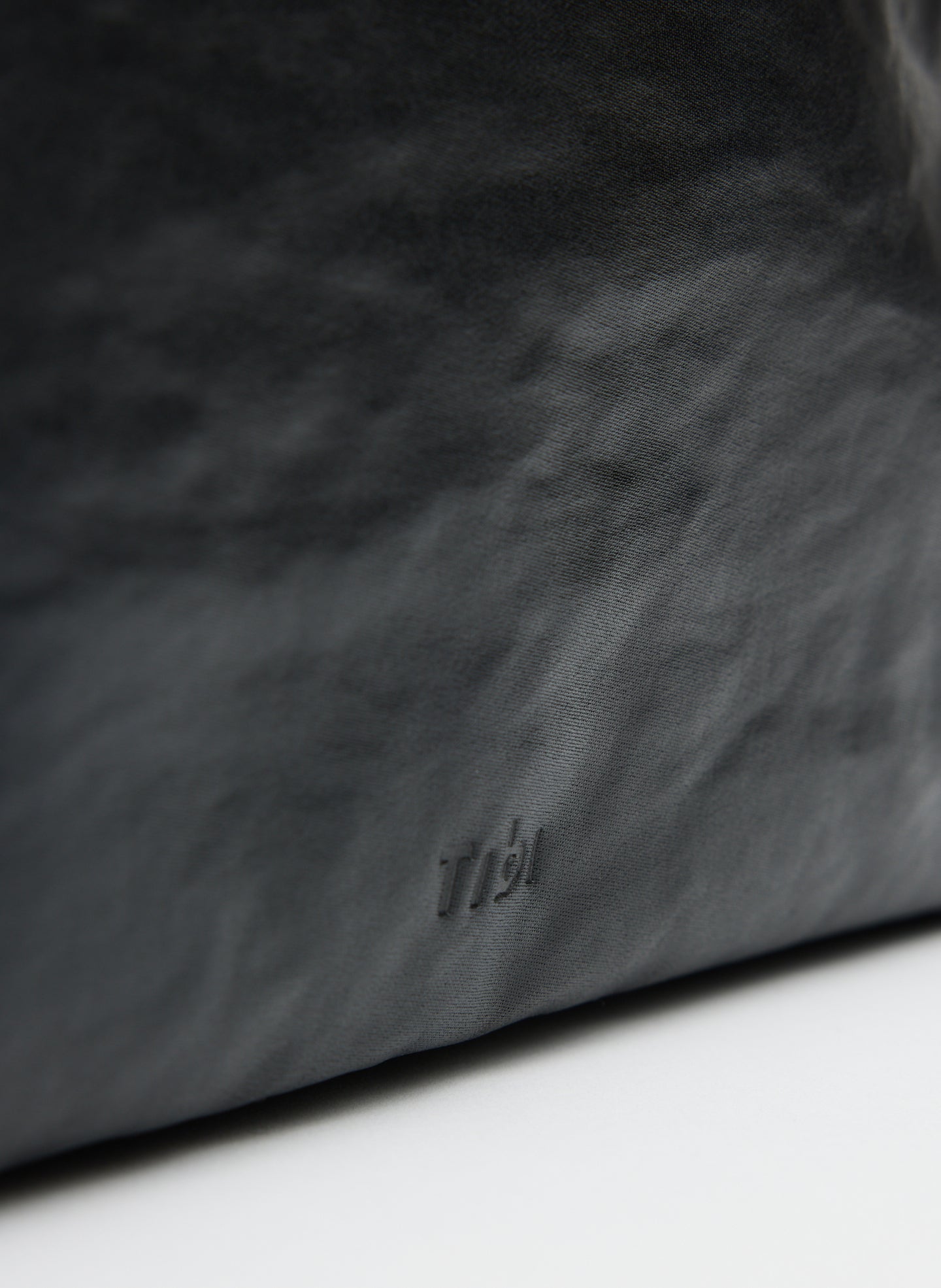 Black Nylon Canvas Pouch - closeup of embossed Tibi logo