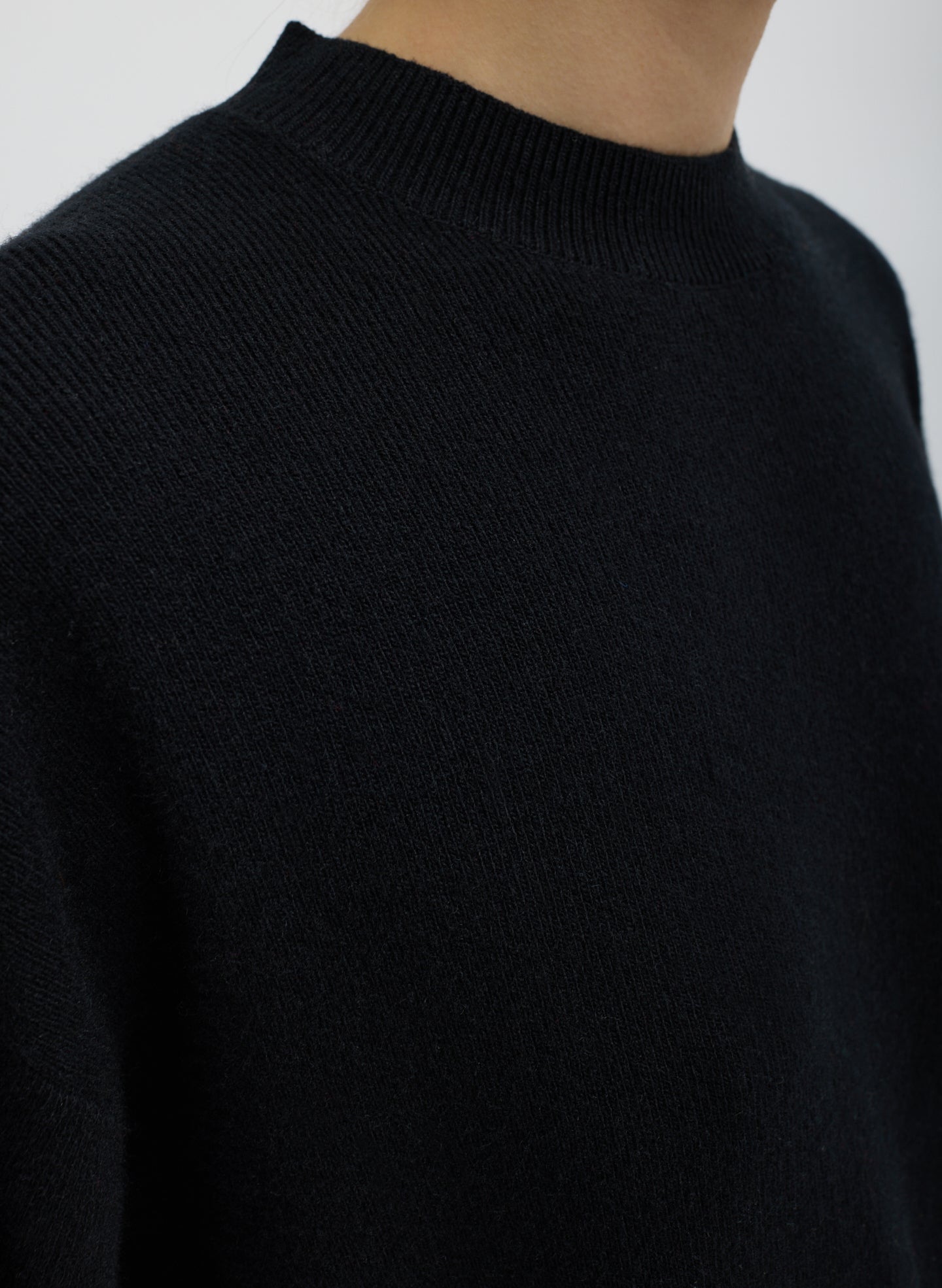 Black Anna Merino Wool Cut Out Racerback Pullover - closeup of ribbed neckline