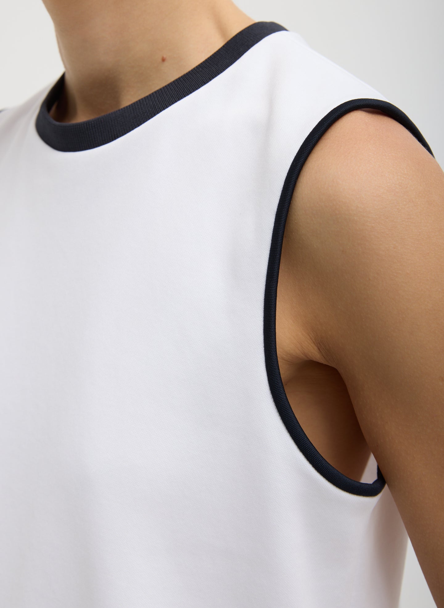 White Active Knit Flip Tank - closeup of navy contrast trim