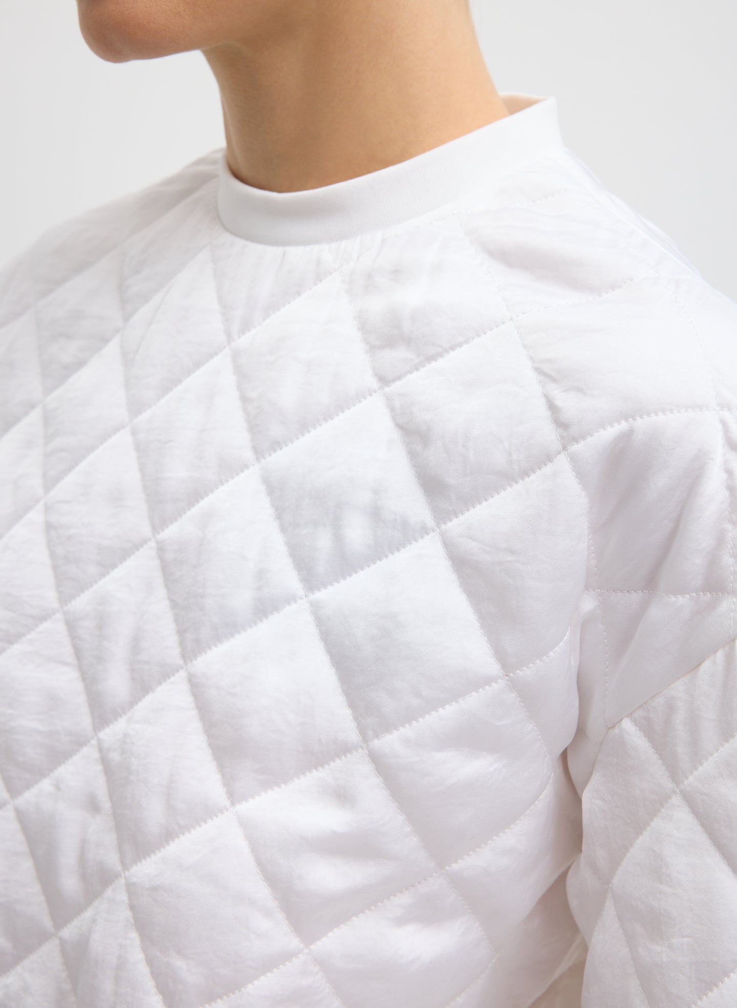 White Cozy Quilting Anorak T-Shirt - closeup of quilted fabric