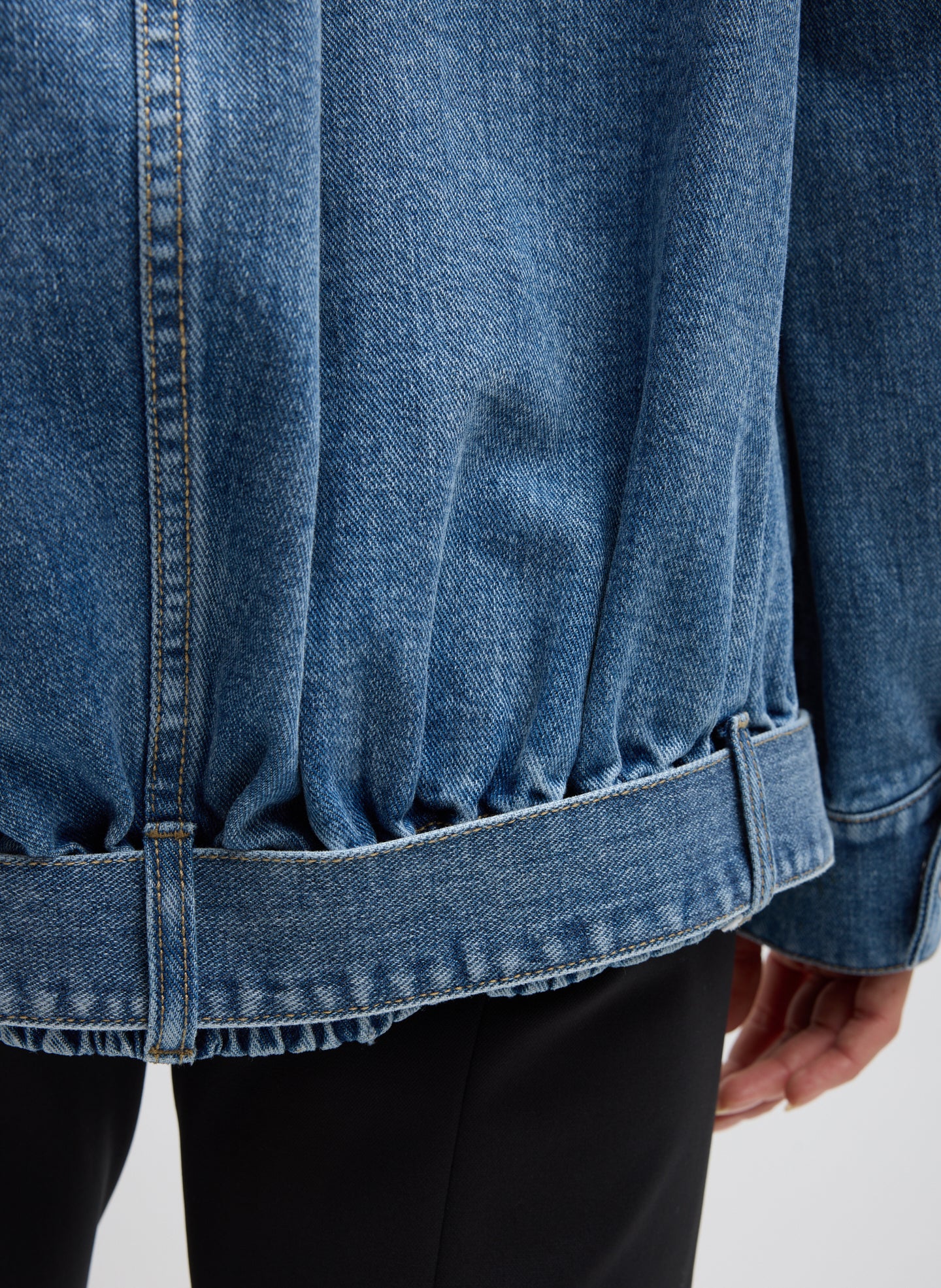 Classic Blue Denim Moto Bomber - closeup of belt detail at hem