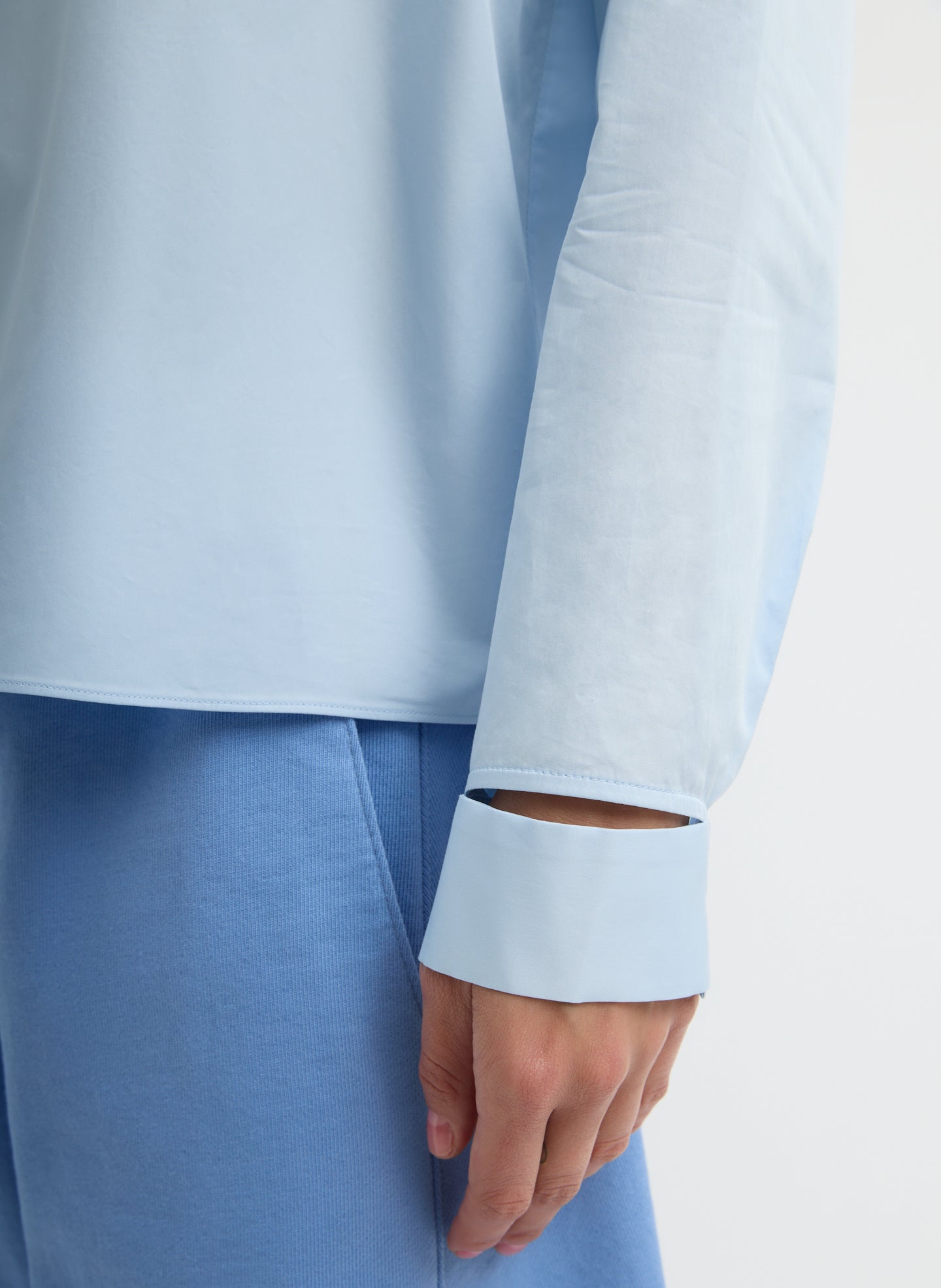 Chambray Blue Eco Poplin Funnel Neck Dolman Top - closeup of slit detail at wrist