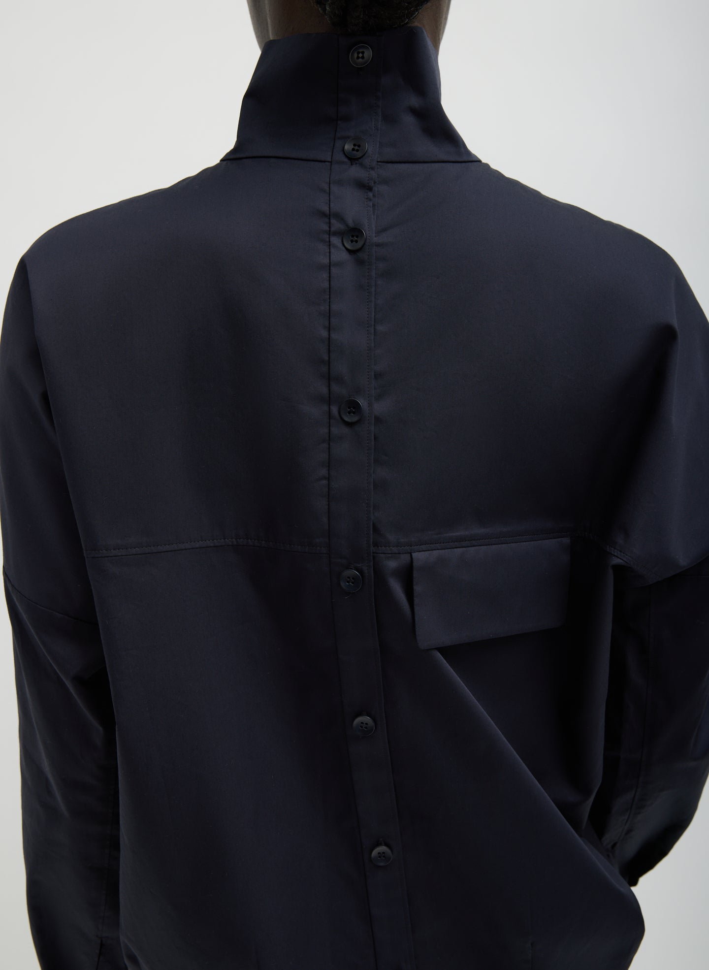 Dark Navy Eco Poplin Funnel Neck Dolman Top - closeup of button details at back