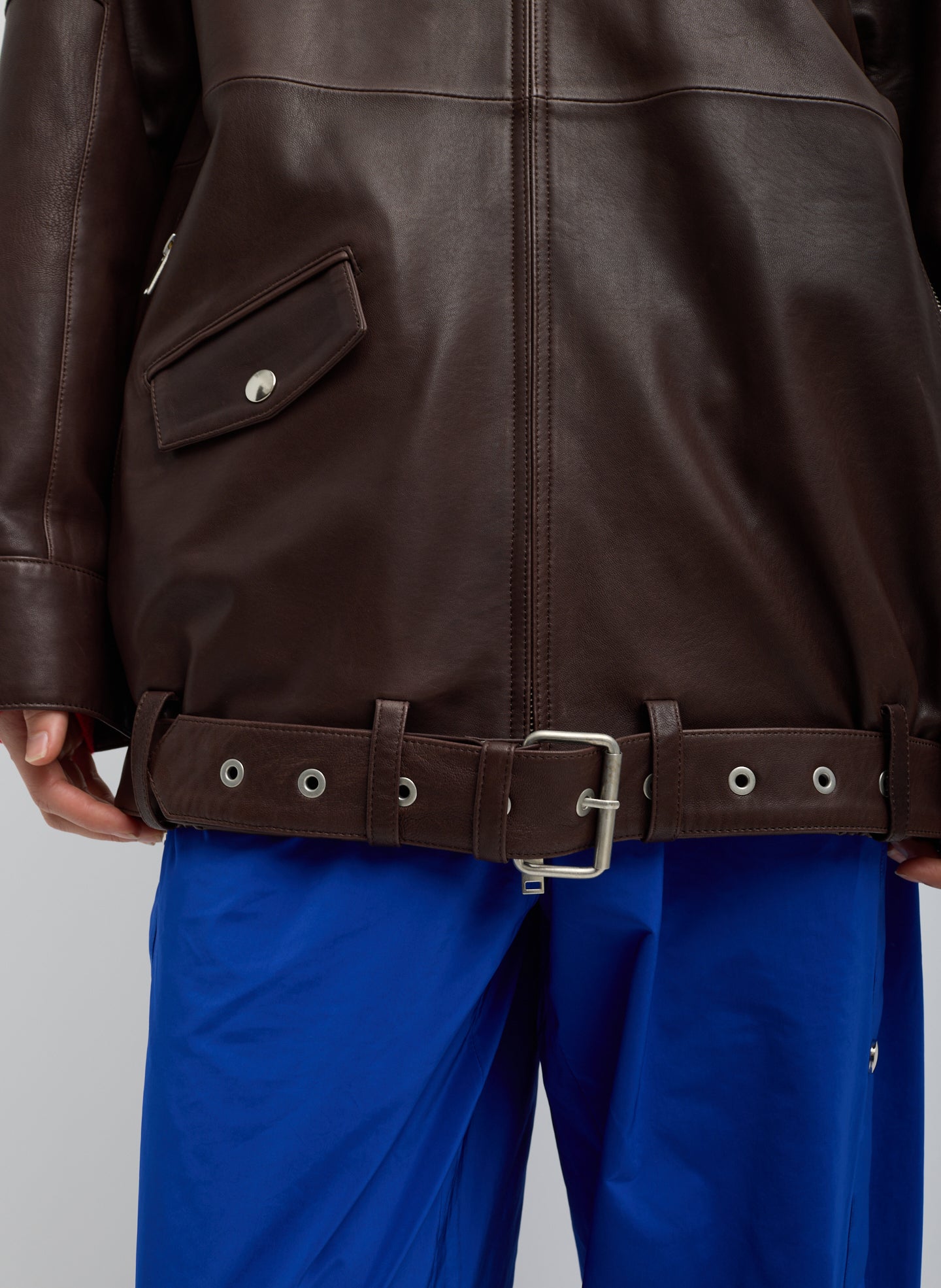 Brown Leather Moto Bomber - closeup of belt detail at hem
